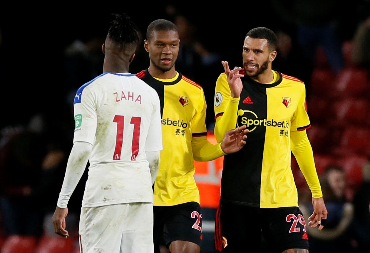 Soccer Football - Premier League - Watford v Crystal Palace - Vicarage Road, Watford, Britain - December 7, 2019  Watford's Etienne Capoue and Christian Kabasele clash with Crystal Palace's Wilfried Zaha after the match          REUTERS/David Klein  EDITORIAL USE ONLY. No use with unauthorized audio, video, data, fixture lists, club/league logos or "live" services. Online in-match use limited to 75 images, no video emulation. No use in betting, games or single club/league/player publications.  P