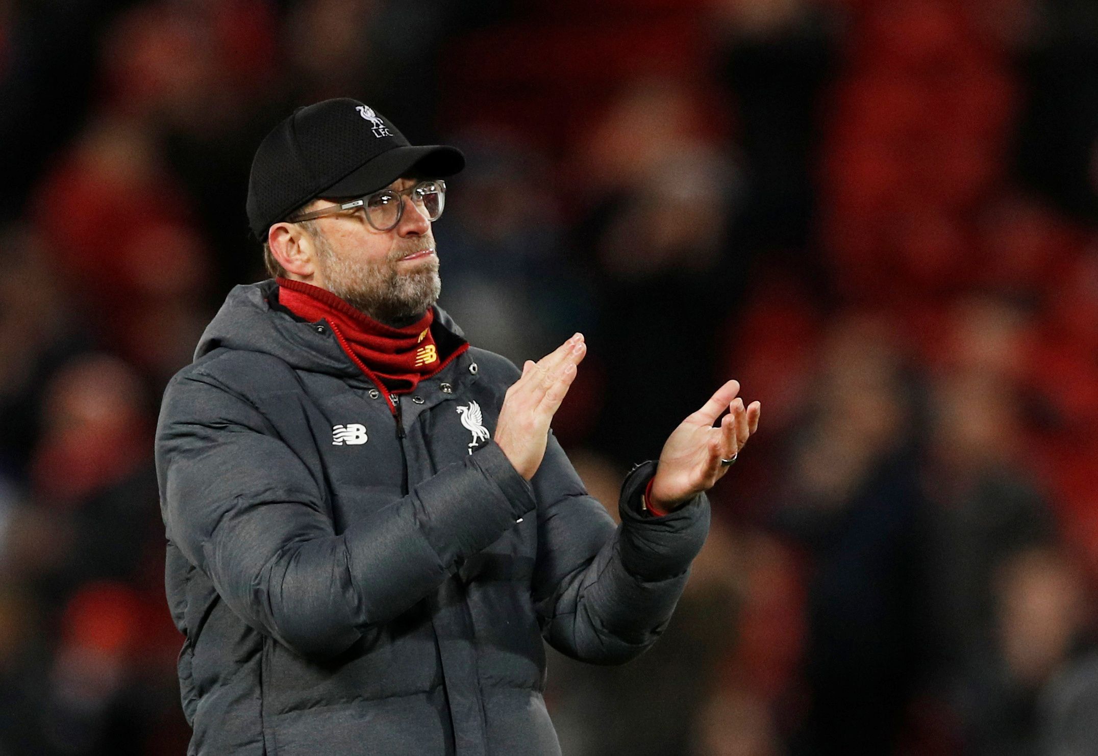 Soccer Football - Champions League - Round of 16 Second Leg - Liverpool v Atletico Madrid - Anfield, Liverpool, Britain - March 11, 2020  Liverpool manager Juergen Klopp looks dejected as he applauds the fans after the match   REUTERS/Phil Noble