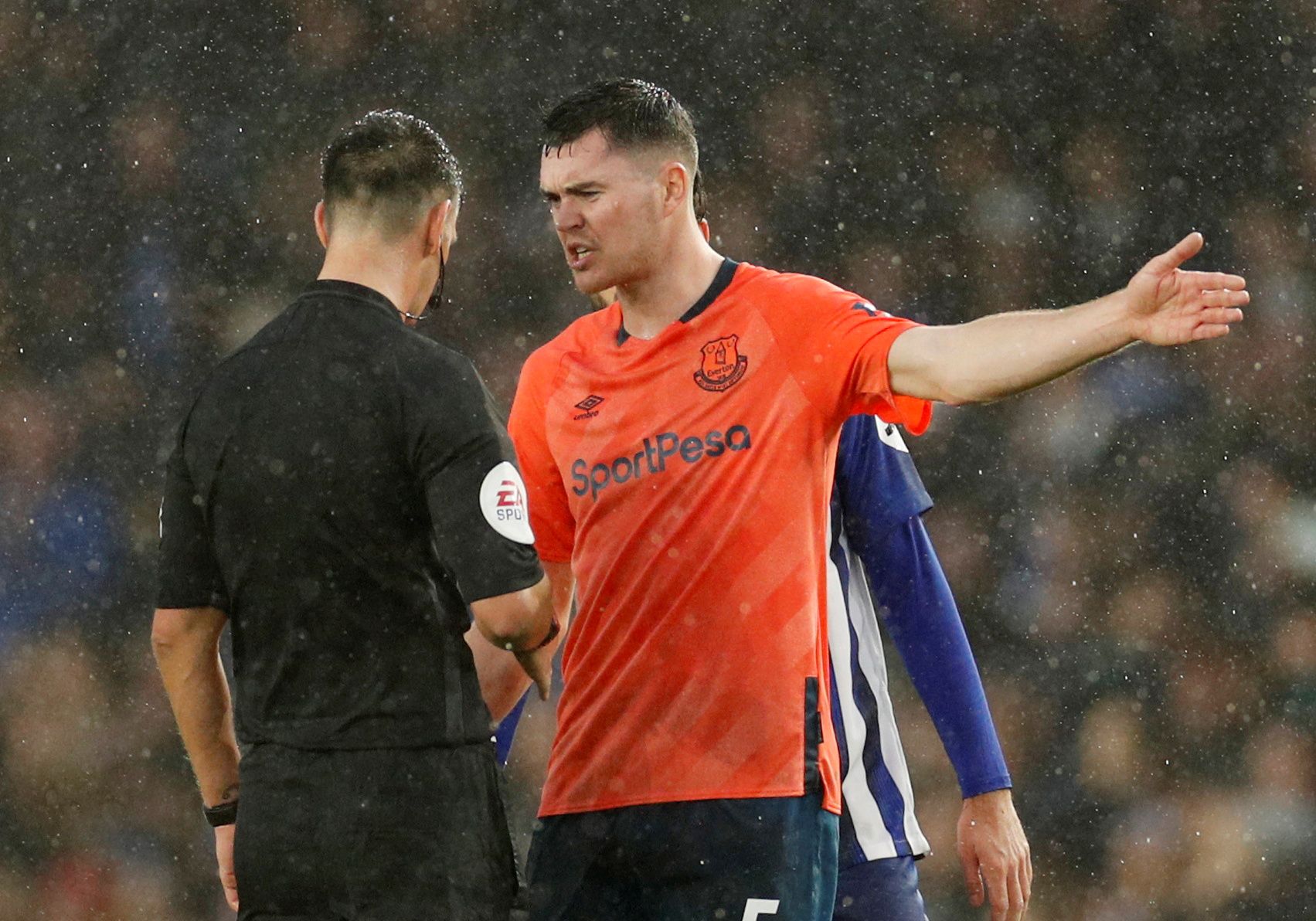 Soccer Football - Premier League - Brighton &amp; Hove Albion v Everton - The American Express Community Stadium, Brighton, Britain - October 26, 2019  Everton's Michael Keane remonstrates with referee Andrew Madley at the end of the match  Action Images via Reuters/John Sibley  EDITORIAL USE ONLY. No use with unauthorized audio, video, data, fixture lists, club/league logos or "live" services. Online in-match use limited to 75 images, no video emulation. No use in betting, games or single club/