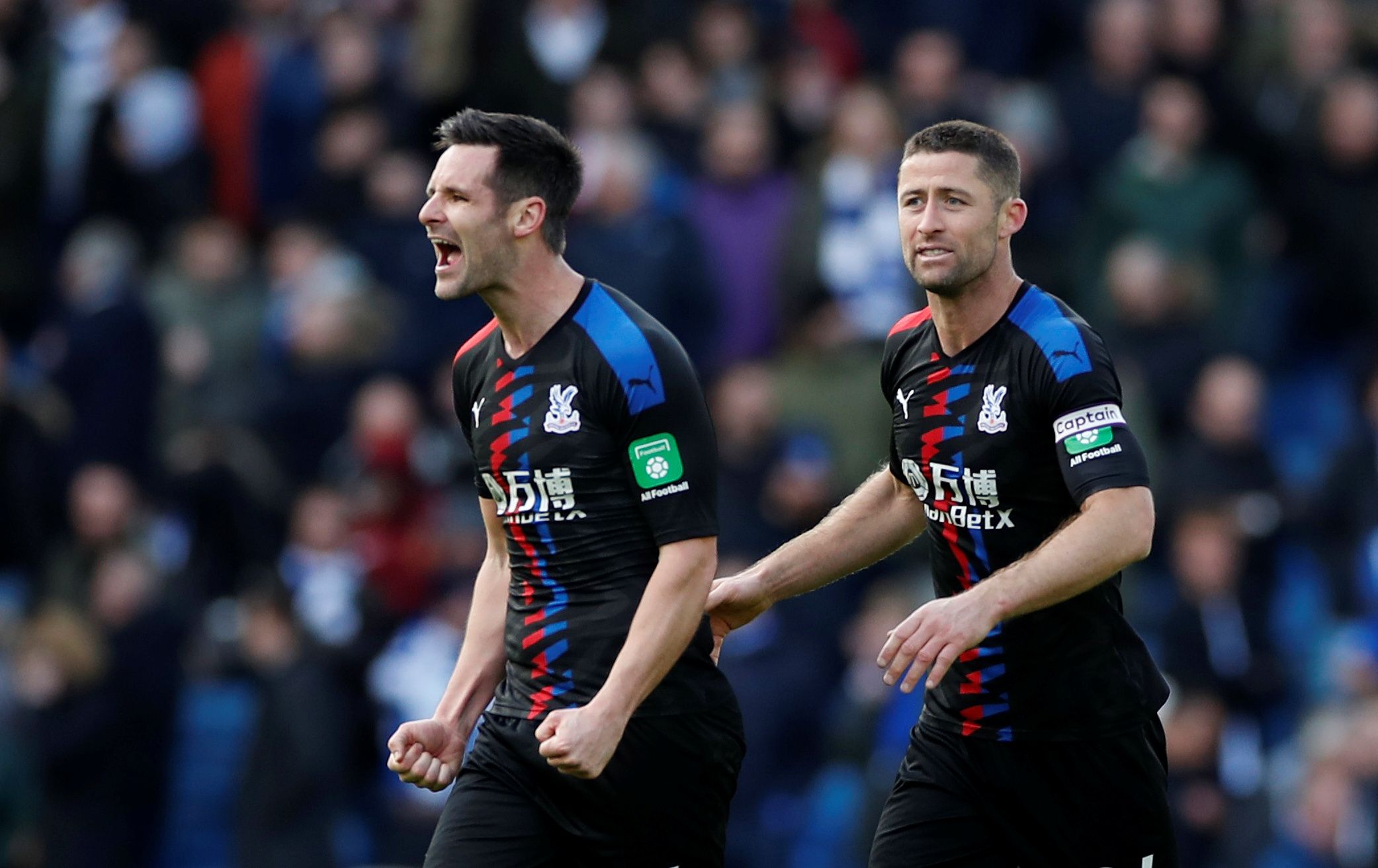 Soccer Football - Premier League - Brighton &amp; Hove Albion v Crystal Palace - The American Express Community Stadium, Brighton, Britain - February 29, 2020  Crystal Palace's Scott Dann and Gary Cahill celebrate after the match   Action Images via Reuters/Paul Childs  EDITORIAL USE ONLY. No use with unauthorized audio, video, data, fixture lists, club/league logos or 