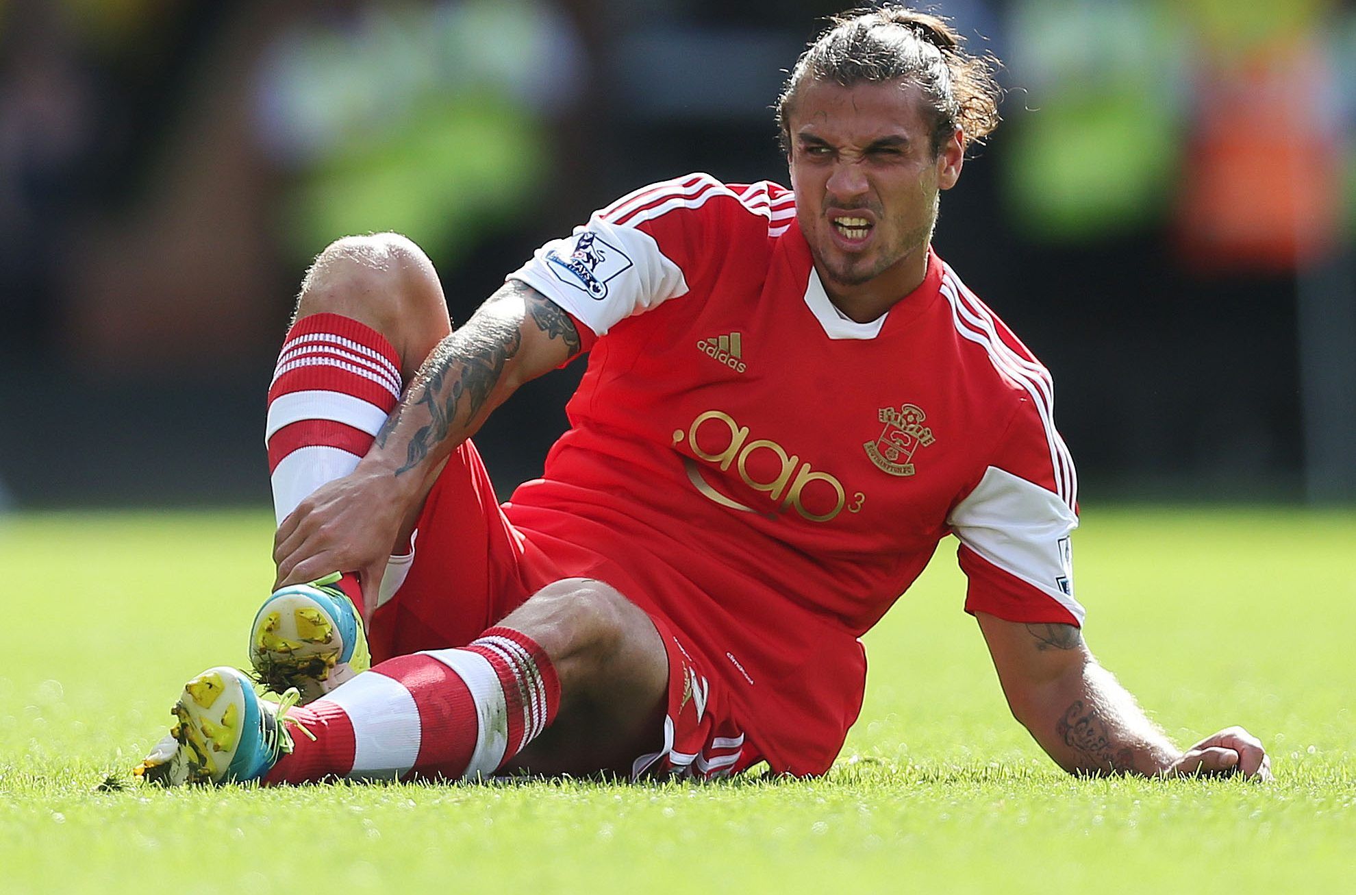 Football - Norwich City v Southampton - Barclays Premier League - Carrow Road - 31/8/13 
Southampton's Daniel Osvaldo sits on the pitch after sustaining an injury 
Mandatory Credit: Action Images / Matthew Childs 
Livepic 
EDITORIAL USE ONLY. No use with unauthorized audio, video, data, fixture lists, club/league logos or live services. Online in-match use limited to 45 images, no video emulation. No use in betting, games or single club/league/player publications.  Please contact your account re