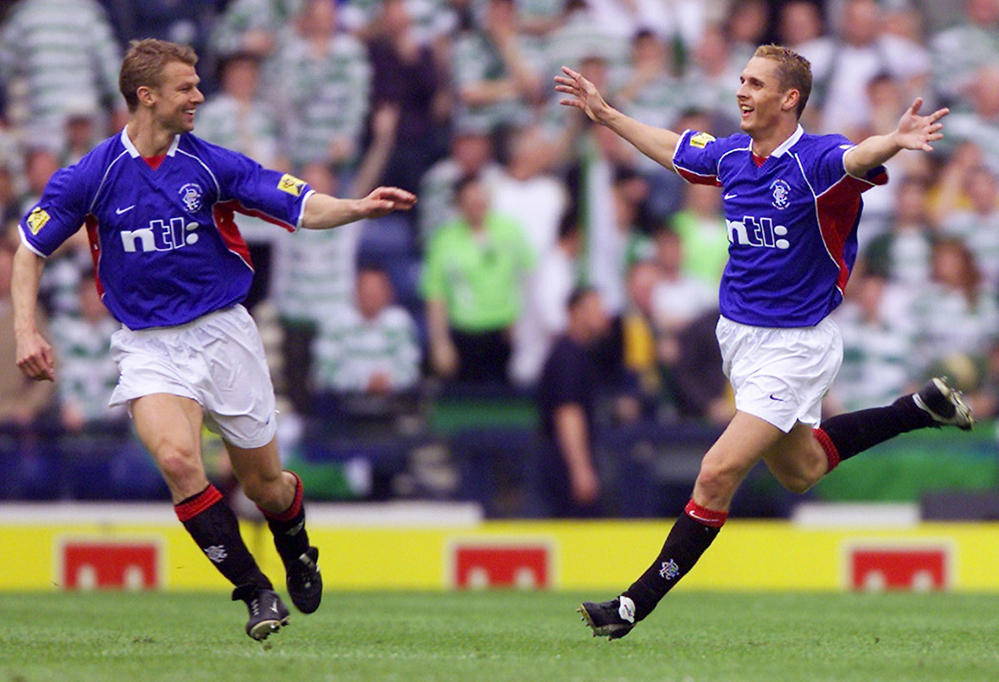 RANGERS' LOVENKRANDS CELEBRATES WITH NUMAN AFTER SCORING AGAINST CELTIC
IN THE SCOTTISH FA CUP FINAL AT HAMPDEN PARK.

	
Rangers' Peter Lovenkrands (R) celebrates scoring against Celtic with
Arthur Numan (L) in the Scottish FA Cup Final at Hampden Park, Glasgow,
Scotland, May 4, 2002. The match finished 3-2 to Rangers. REUTERS/Jeff
J Mitchell