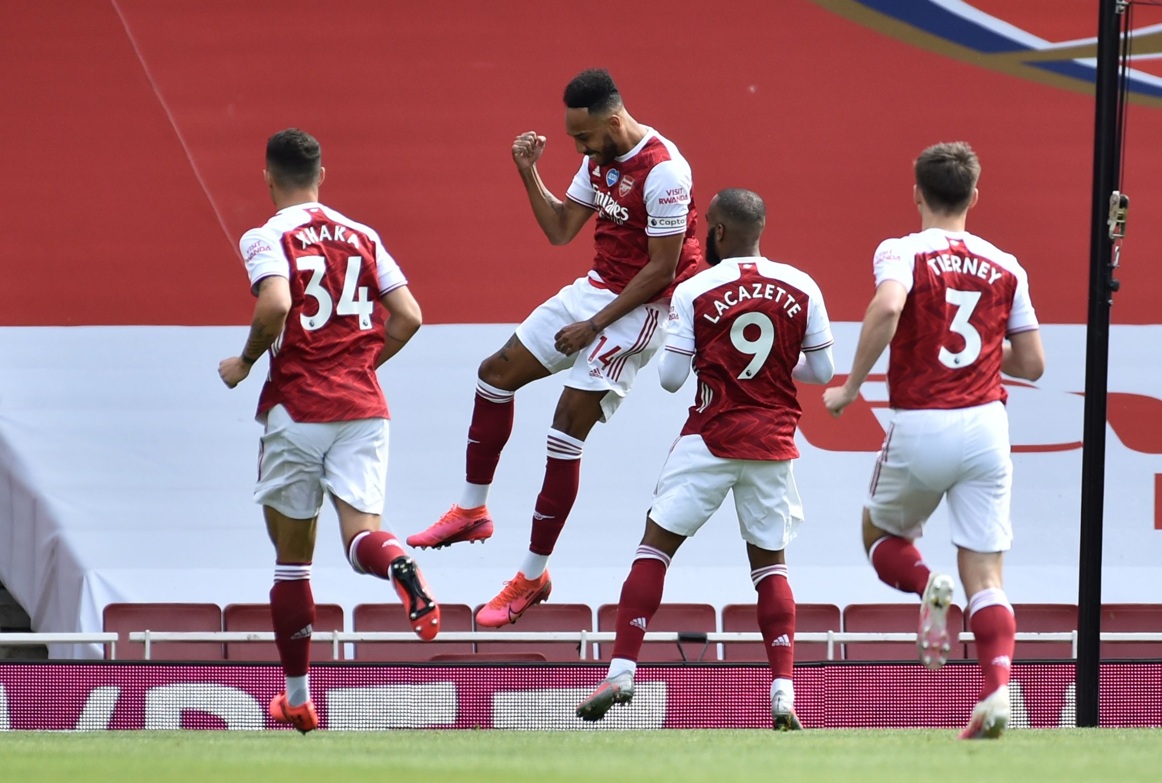 Soccer Football - Premier League - Arsenal v Watford - Emirates Stadium, London, Britain - July 26, 2020  Arsenal's Pierre-Emerick Aubameyang celebrates scoring their first goal with Alexandre Lacazette and teammates, as play resumes behind closed doors following the outbreak of the coronavirus disease (COVID-19) Pool via REUTERS/Rui Vieira EDITORIAL USE ONLY. No use with unauthorized audio, video, data, fixture lists, club/league logos or 'live' services. Online in-match use limited to 75 image
