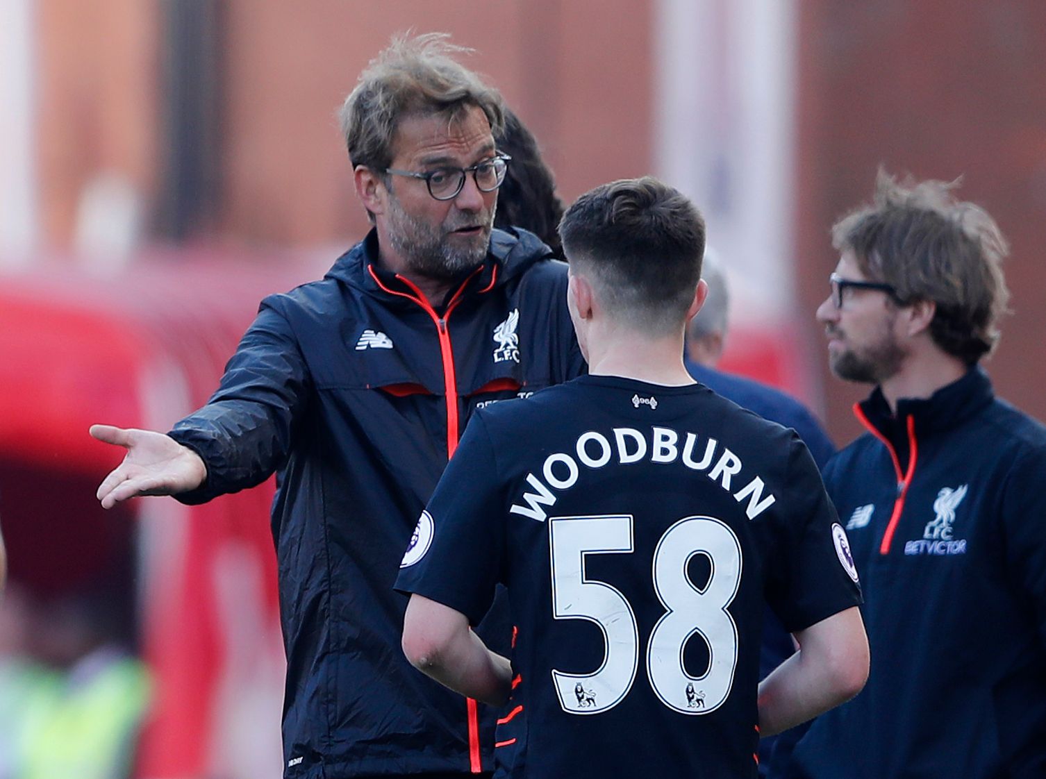 Britain Football Soccer - Stoke City v Liverpool - Premier League - bet365 Stadium - 8/4/17 Liverpool manager Juergen Klopp speaks with Ben Woodburn  Action Images via Reuters / Carl Recine Livepic EDITORIAL USE ONLY. No use with unauthorized audio, video, data, fixture lists, club/league logos or 