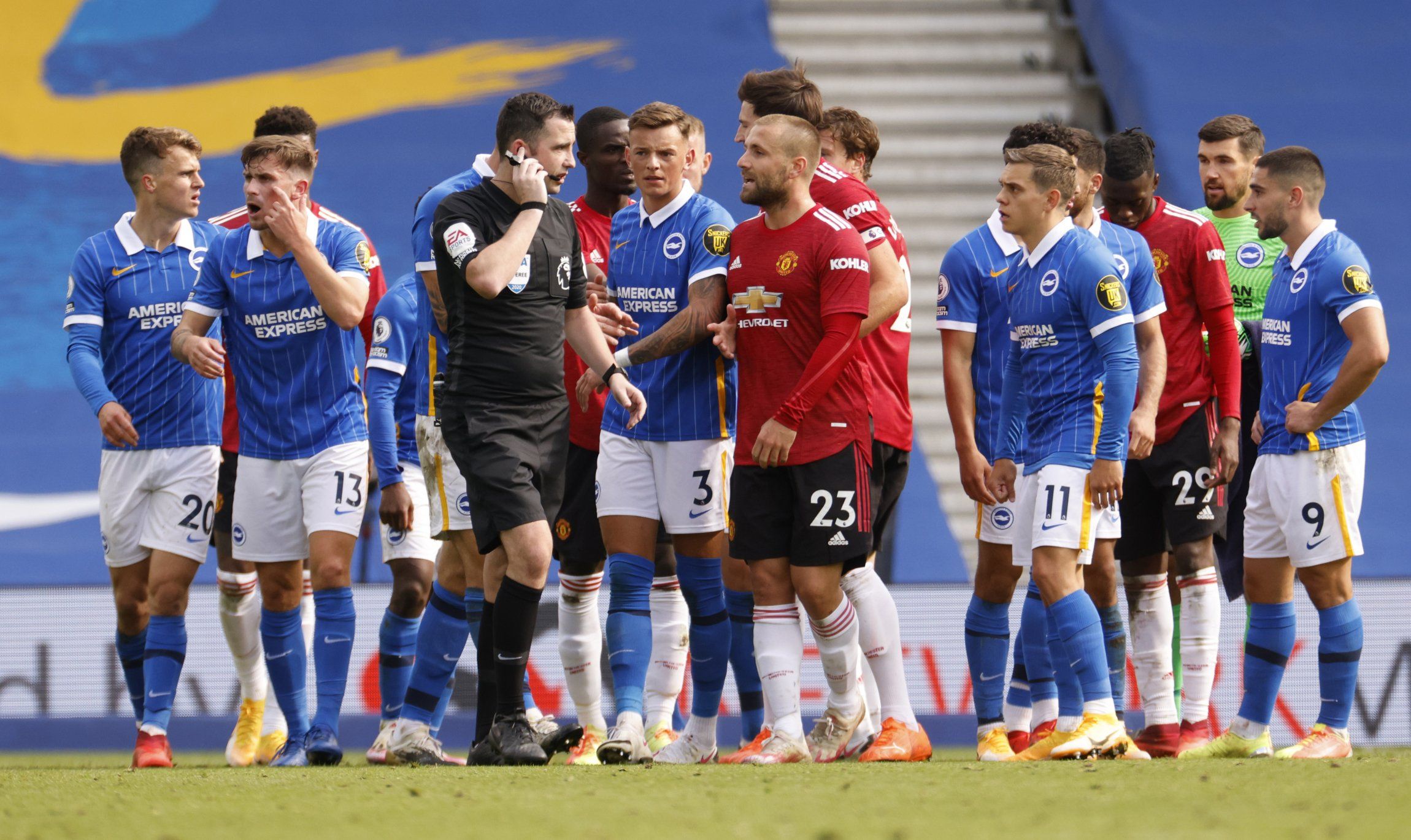 manchester-united-and-brighton-players-argue-with-referee-chris-kavanagh-over-var