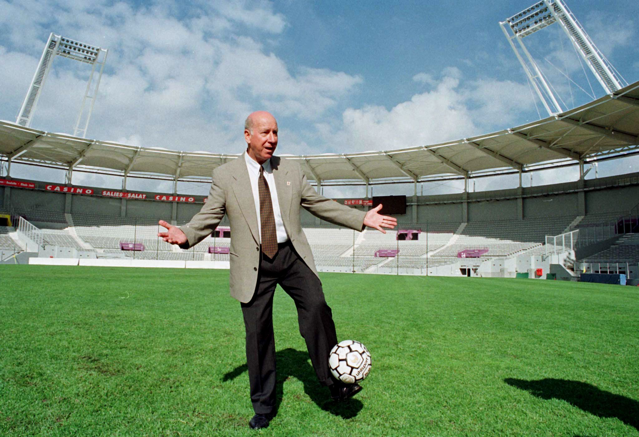 Sir Bobby Charlton, former Manchester United and British international soccer player, plays with a ball during a visit to the new Toulouse Stadium, April 28. England will meet Romania in Toulouse during the 16th soccer World Cup which will take place in France in June 1998.

REUTERS