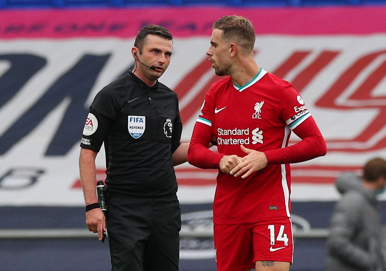 Soccer Football - Premier League - Everton v Liverpool - Goodison Park, Liverpool, Britain - October 17, 2020  Liverpool's Jordan Henderson speaks with referee Michael Oliver after the match Pool via REUTERS/Peter Byrne EDITORIAL USE ONLY. No use with unauthorized audio, video, data, fixture lists, club/league logos or 'live' services. Online in-match use limited to 75 images, no video emulation. No use in betting, games or single club /league/player publications.  Please contact your account re