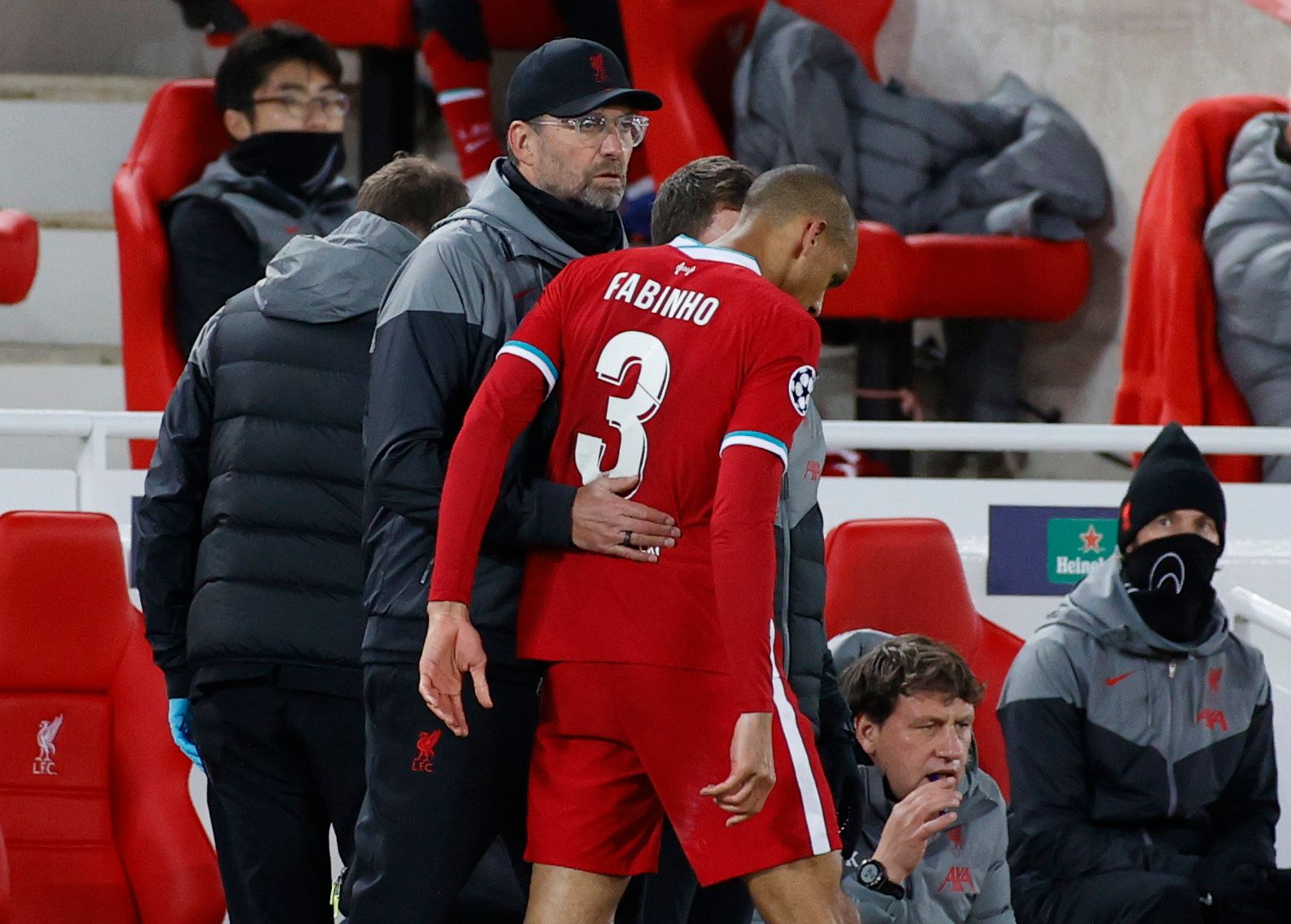 Soccer Football - Champions League - Group D - Liverpool v FC Midtjylland - Anfield, Liverpool, Britain - October 27, 2020 Liverpool's Fabinho with manager Juergen Klopp after being substituted after sustaining an injury Pool via REUTERS/Phil Noble