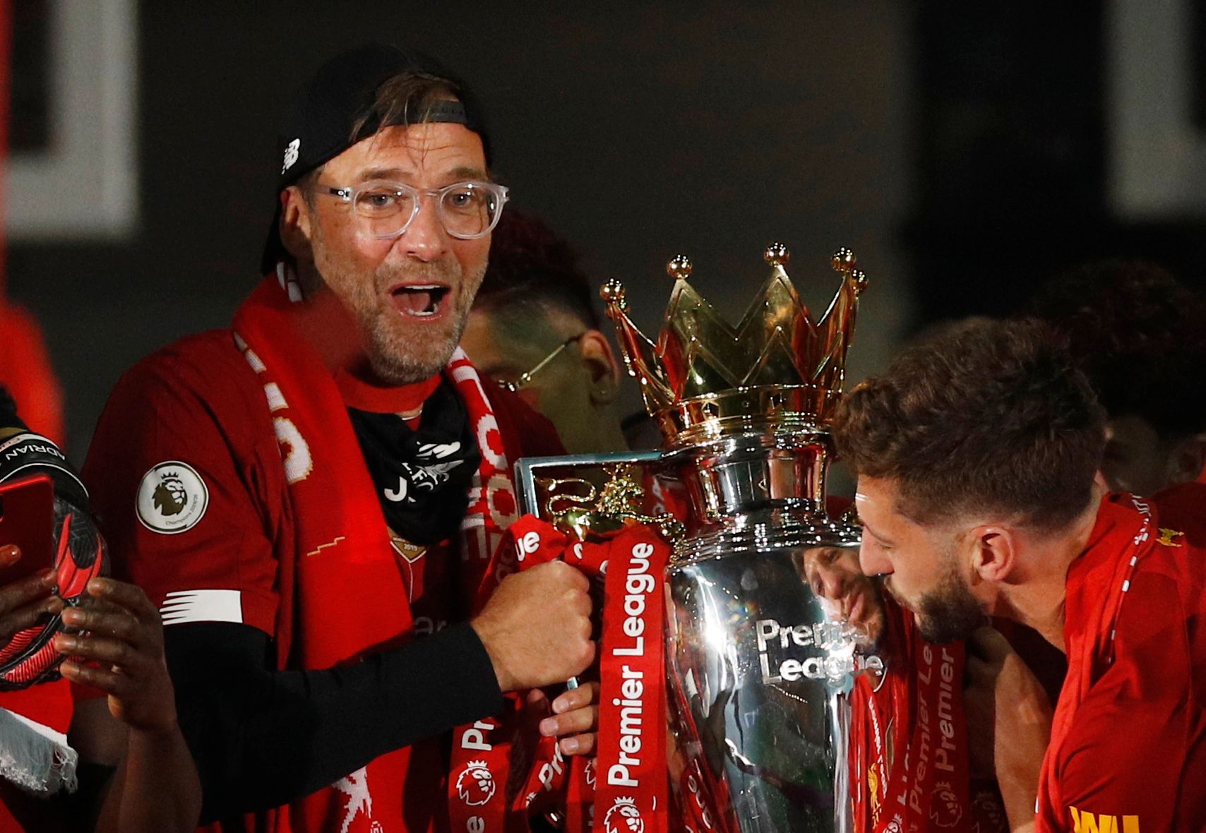 Soccer Football - Premier League - Liverpool v Chelsea - Anfield, Liverpool, Britain - July 22, 2020 Liverpool manager Juergen Klopp celebrates with the trophy after winning the Premier League Pool via REUTERS/Phil Noble EDITORIAL USE ONLY. No use with unauthorized audio, video, data, fixture lists, club/league logos or 'live' services. Online in-match use limited to 75 images, no video emulation. No use in betting, games or single club/league/player publications.  Please contact your account re