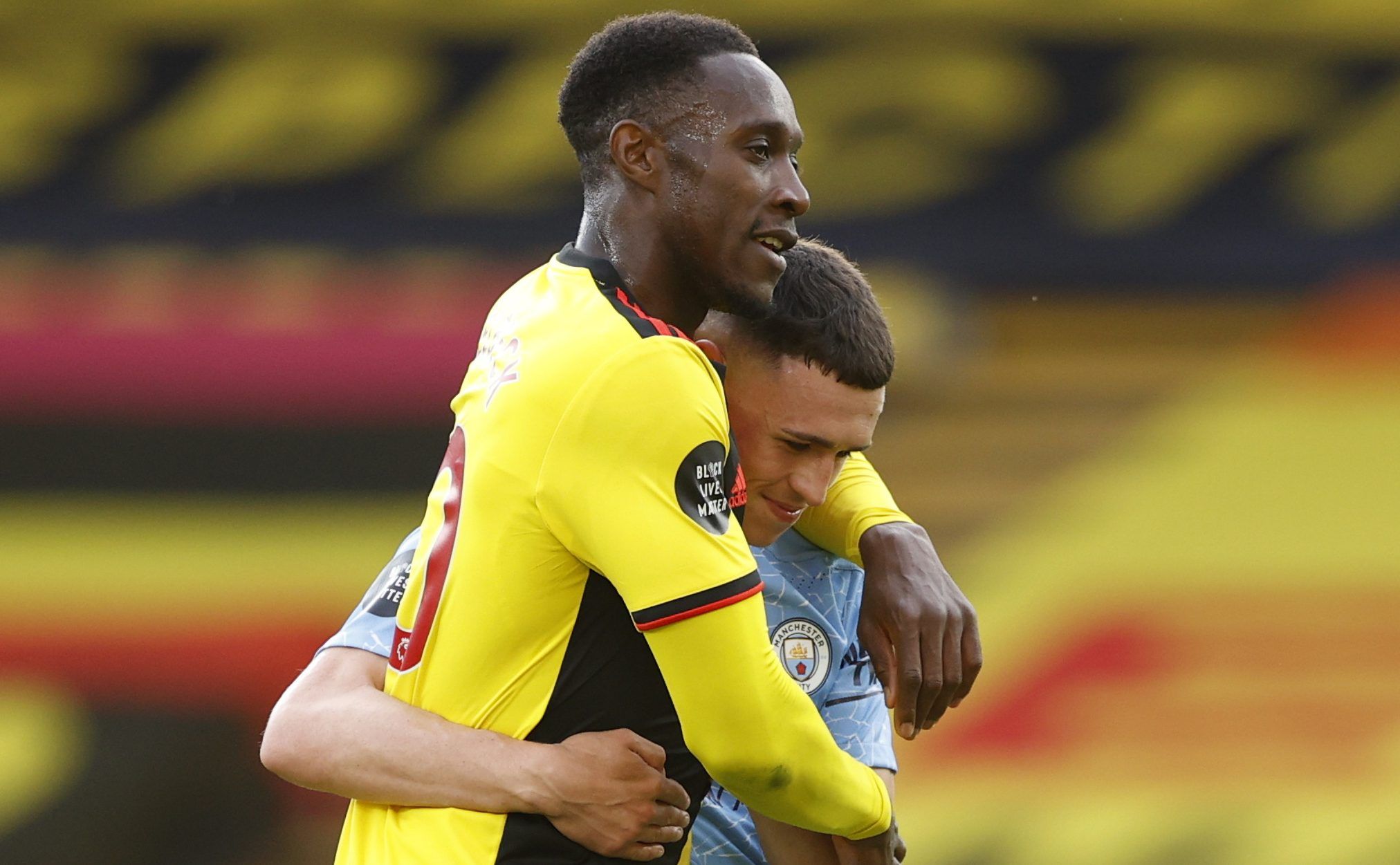 Soccer Football - Premier League - Watford v Manchester City - Vicarage Road, Watford, Britain - July 21, 2020 Manchester City's Phil Foden and Watford's Danny Welbeck after the match, as play resumes behind closed doors following the outbreak of the coronavirus disease (COVID-19) Pool via REUTERS/John Sibley EDITORIAL USE ONLY. No use with unauthorized audio, video, data, fixture lists, club/league logos or 'live' services. Online in-match use limited to 75 images, no video emulation. No use in