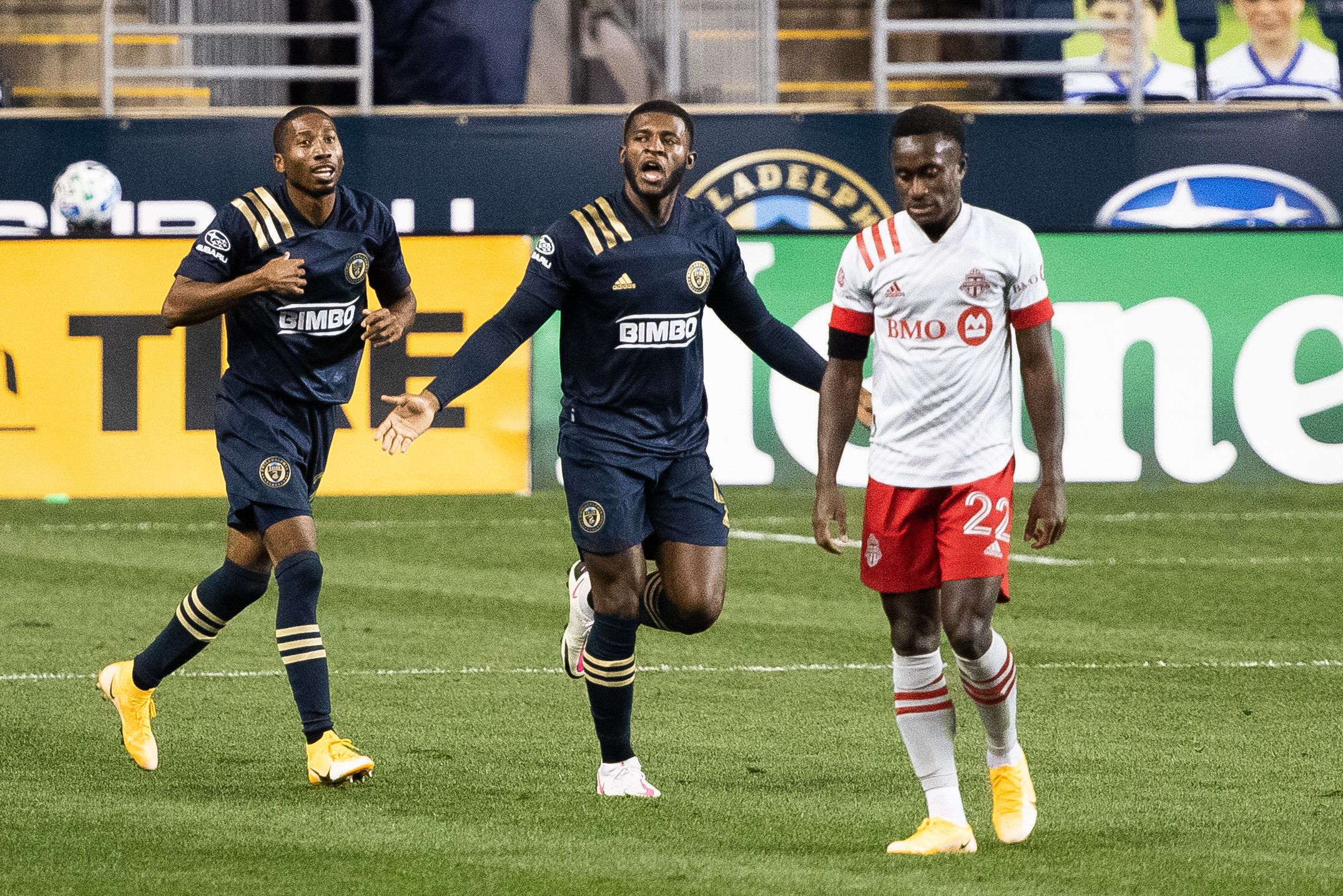 Oct 24, 2020; Philadelphia, Pennsylvania, USA; Philadelphia Union defender Mark McKenzie (4) reacts in front of defender Ray Gaddis (28) and midfielder Richie Laryea (22) after scoring during the first half at Subaru Park. Mandatory Credit: Bill Streicher-USA TODAY Sports