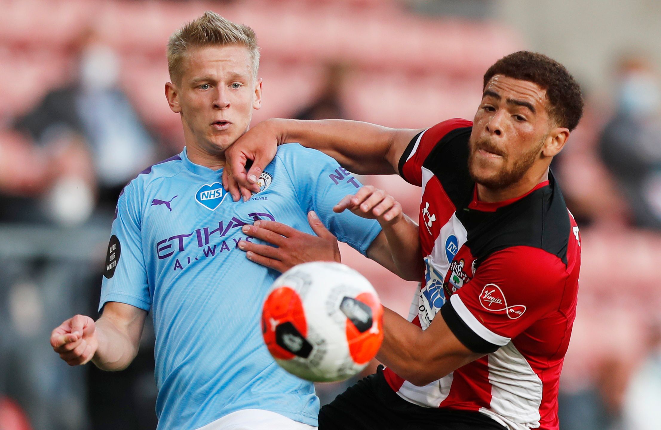 Soccer Football - Premier League - Southampton v Manchester City - St Mary's Stadium, Southampton, Britain - July 5, 2020  Manchester City's Oleksandr Zinchenko in action with Southampton's Che Adams, as play resumes behind closed doors following the outbreak of the coronavirus disease (COVID-19) Frank Augstein / Pool via REUTERS  EDITORIAL USE ONLY. No use with unauthorized audio, video, data, fixture lists, club/league logos or 