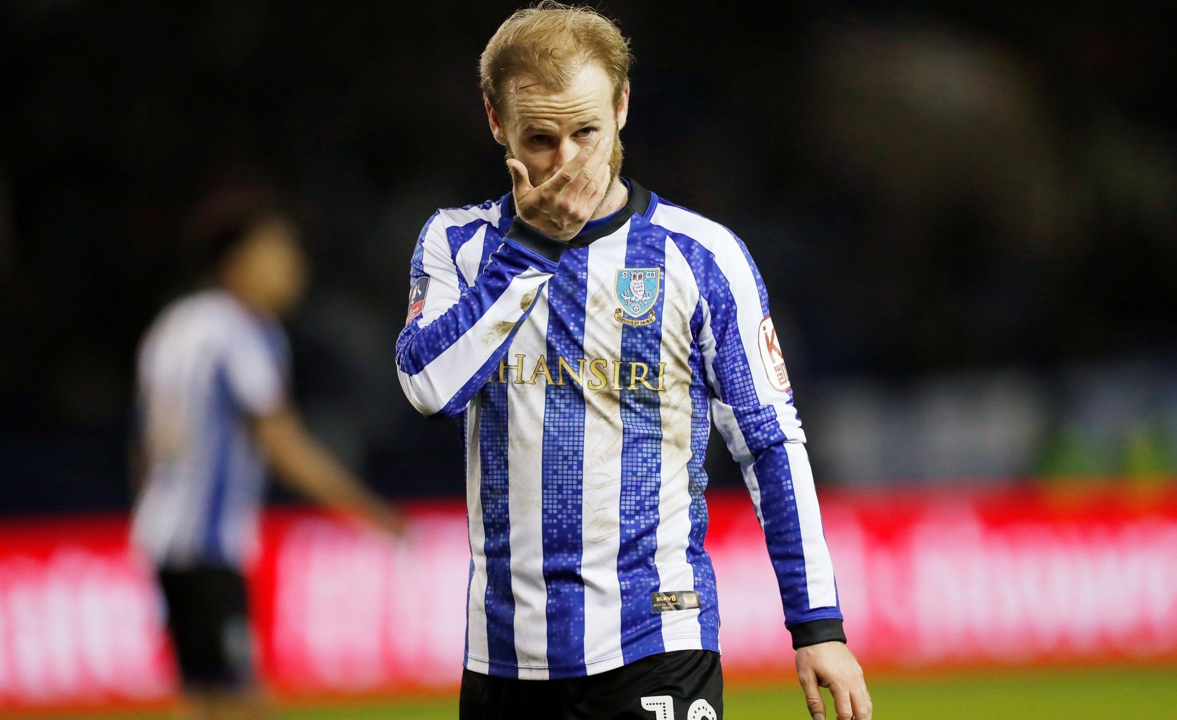 sheffield wednesday midfielder and captain barry bannan looks on