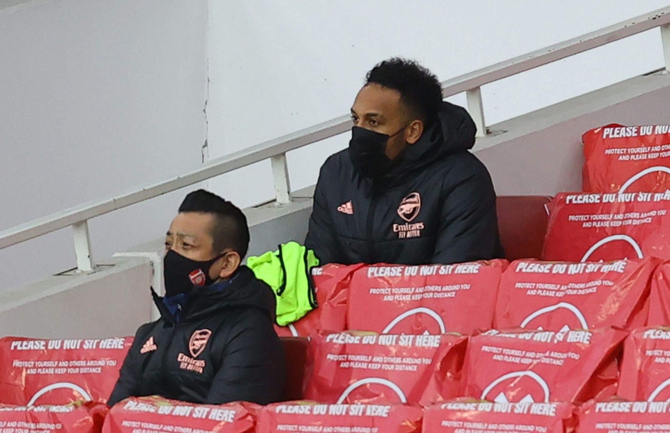 Soccer Football - Premier League - Arsenal v Tottenham Hotspur - Emirates Stadium, London, Britain - March 14, 2021 Arsenal's Pierre-Emerick Aubameyang on the substitutes bench Pool via REUTERS/Julian Finney EDITORIAL USE ONLY. No use with unauthorized audio, video, data, fixture lists, club/league logos or 'live' services. Online in-match use limited to 75 images, no video emulation. No use in betting, games or single club /league/player publications.  Please contact your account representative