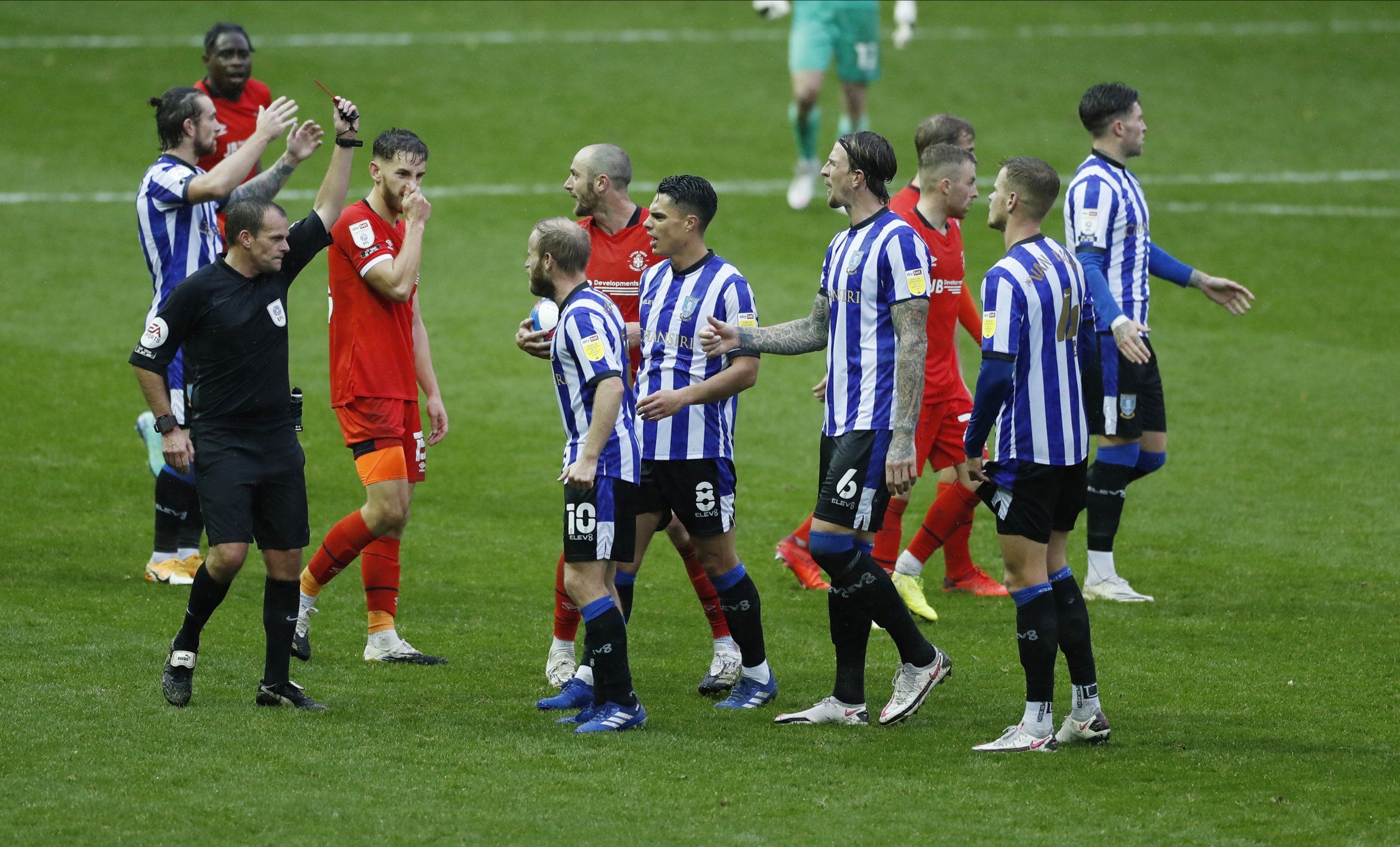 sheffield wednesday defender joost van aken is shown a red card