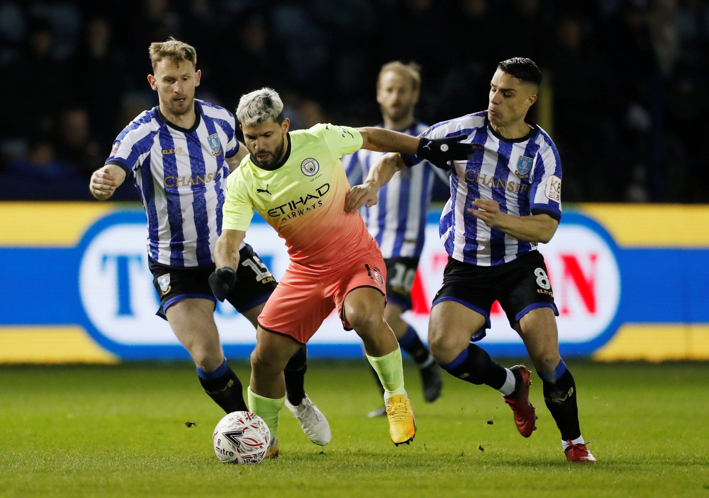sheffield wednesday midfielder joey pelupessy in action with man city striker sergio aguero fa cup fifth round