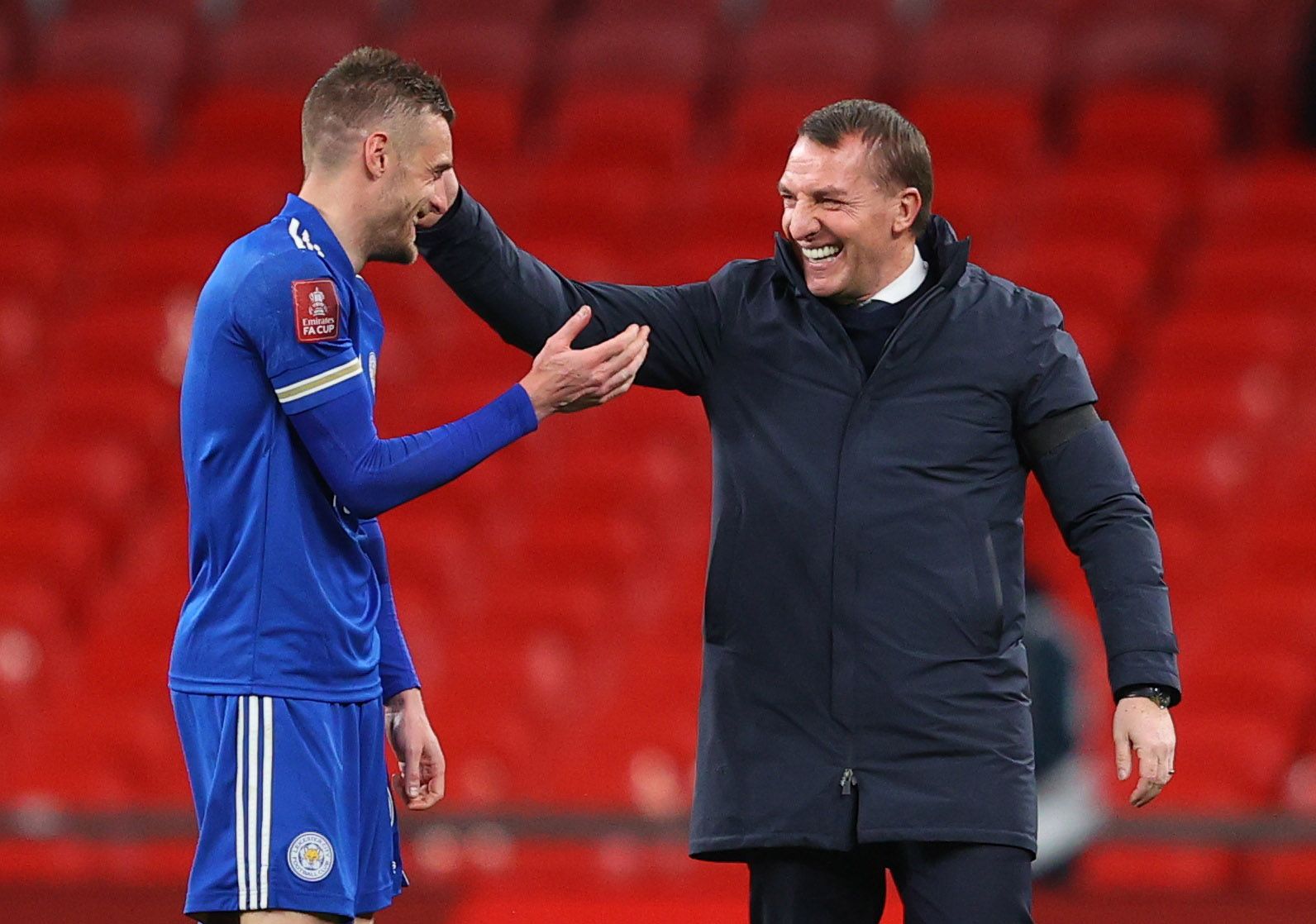 Soccer Football -  FA Cup Semi Final - Leicester City v Southampton  - Wembley Stadium, London, Britain - April 18, 2021 Leicester City's Jamie Vardy and manager Brendan Rodgers celebrate after the match Pool via REUTERS/Richard Heathcote