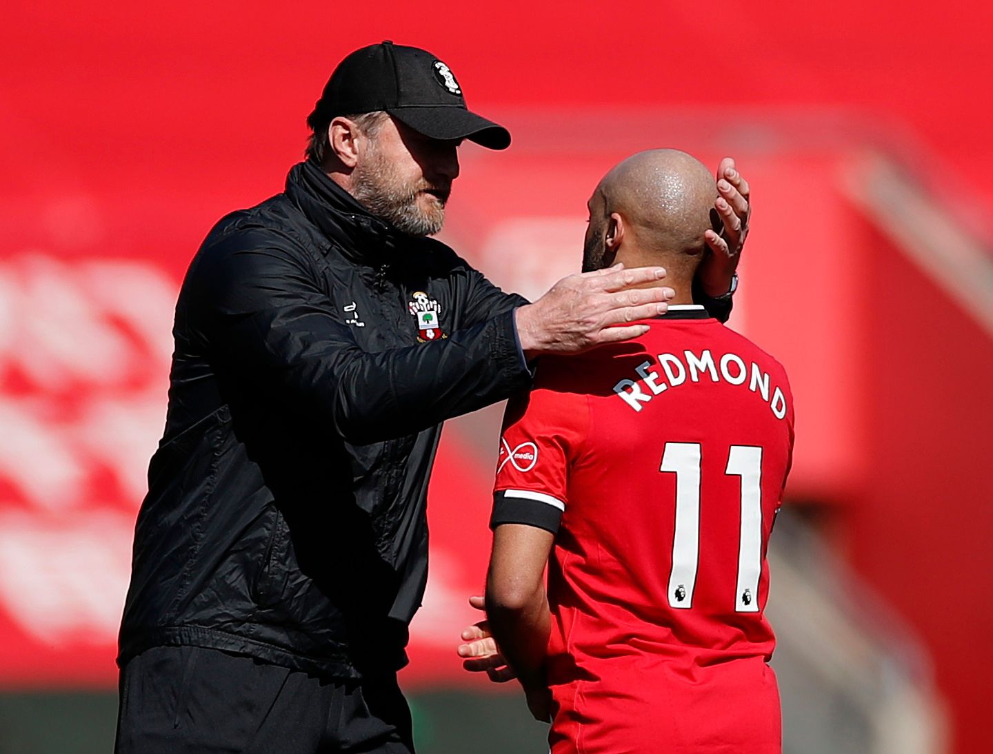 Soccer Football - Premier League - Southampton v Burnley - St Mary's Stadium, Southampton, Britain - April 4, 2021 Southampton manager Ralph Hasenhuttl celebrates after the match with Nathan Redmond Pool via REUTERS/Andrew Boyers EDITORIAL USE ONLY. No use with unauthorized audio, video, data, fixture lists, club/league logos or 'live' services. Online in-match use limited to 75 images, no video emulation. No use in betting, games or single club /league/player publications.  Please contact your 