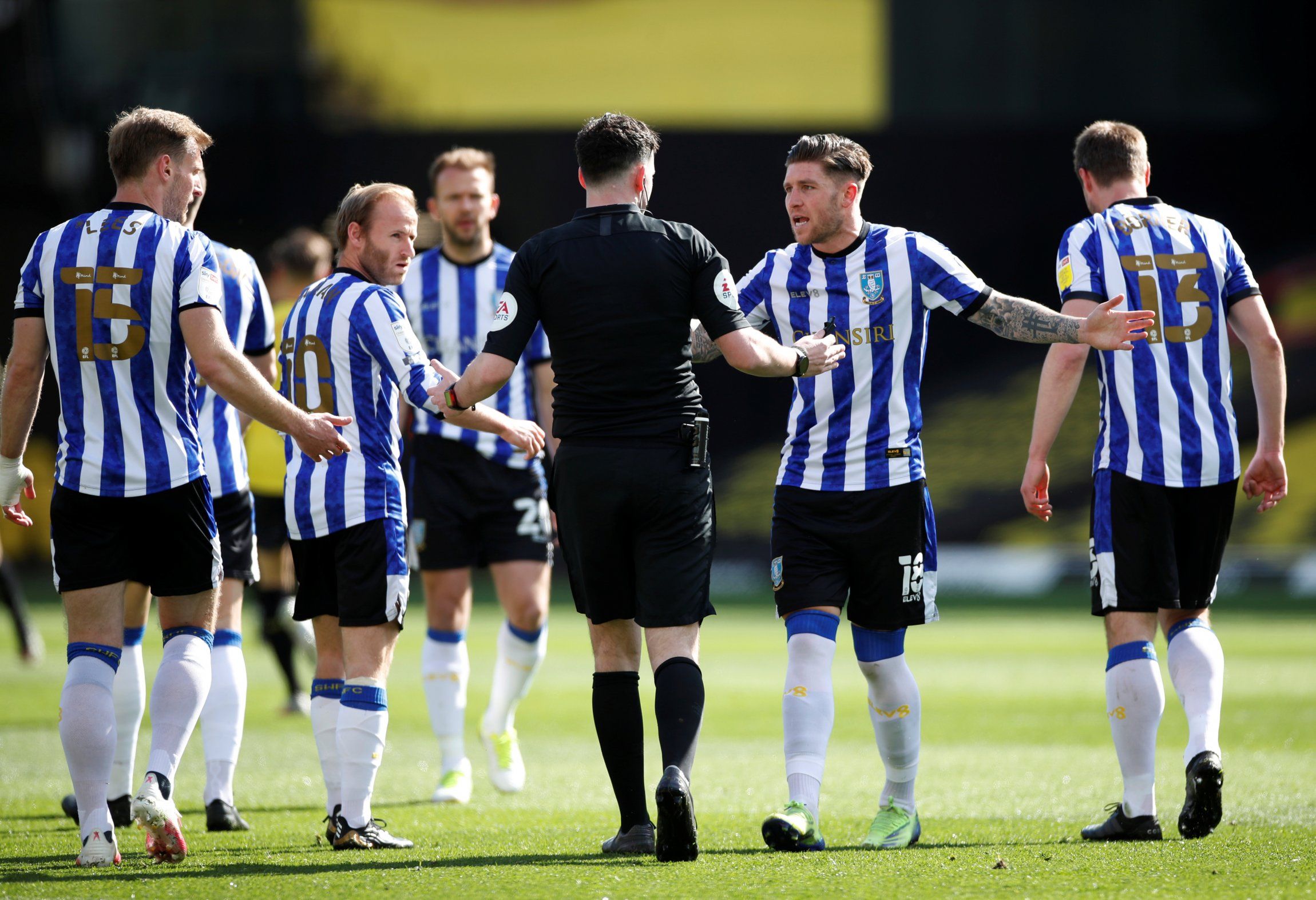sheffield wednesday players argue with referee after watford goal