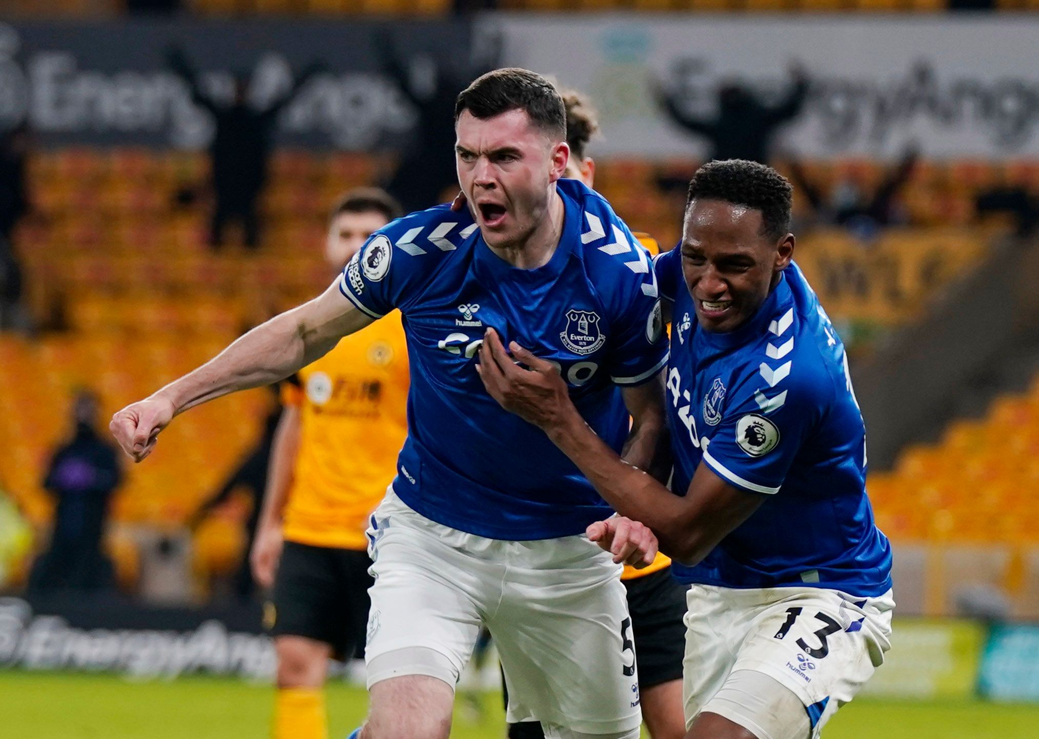 Soccer Football - Premier League - Wolverhampton Wanderers v Everton - Molineux Stadium, Wolverhampton, Britain - January 12, 2021 Everton's Michael Keane celebrates scoring their second goal with Yerry Mina Pool via REUTERS/Tim Keeton EDITORIAL USE ONLY. No use with unauthorized audio, video, data, fixture lists, club/league logos or 'live' services. Online in-match use limited to 75 images, no video emulation. No use in betting, games or single club /league/player publications.  Please contact