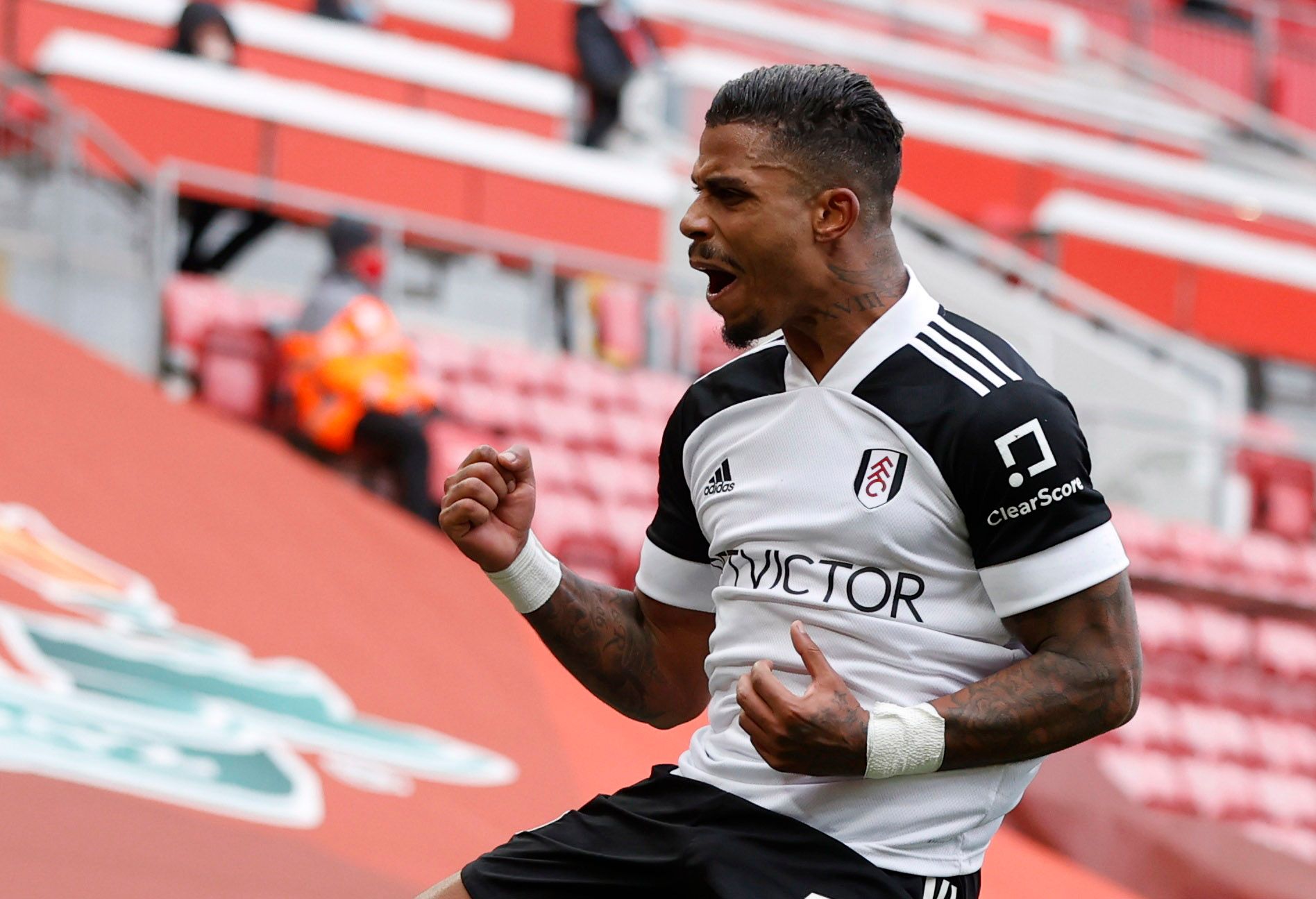 Soccer Football - Premier League - Liverpool v Fulham - Anfield, Liverpool, Britain - March 7, 2021  Fulham's Mario Lemina celebrates scoring their first goal Pool via REUTERS/Phil Noble EDITORIAL USE ONLY. No use with unauthorized audio, video, data, fixture lists, club/league logos or 'live' services. Online in-match use limited to 75 images, no video emulation. No use in betting, games or single club /league/player publications.  Please contact your account representative for further details.