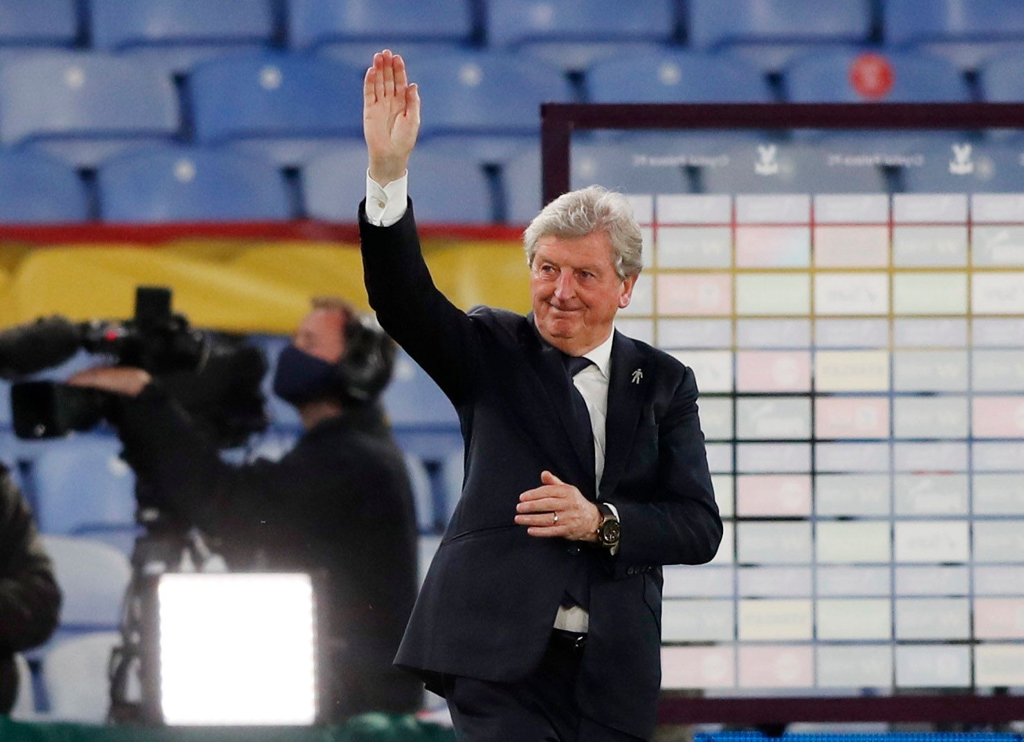 Soccer Football - Premier League - Crystal Palace v Arsenal - Selhurst Park, London, Britain - May 19, 2021 Crystal Palace manager Roy Hodgson waves to fans during a lap of appreciation after the match Pool via REUTERS/Frank Augstein EDITORIAL USE ONLY. No use with unauthorized audio, video, data, fixture lists, club/league logos or 'live' services. Online in-match use limited to 75 images, no video emulation. No use in betting, games or single club /league/player publications.  Please contact y