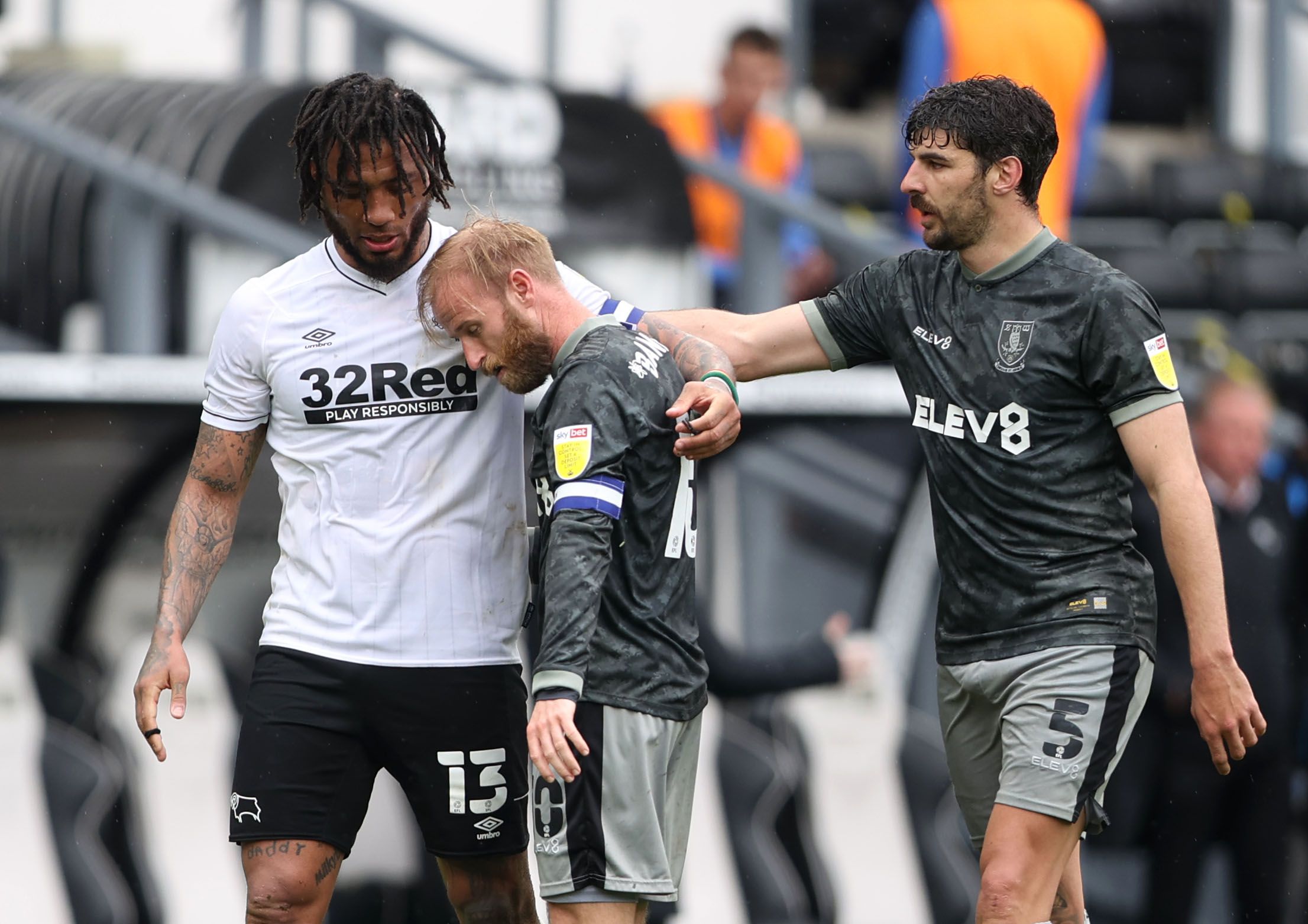 Soccer Football - Championship - Derby County v Sheffield Wednesday - Pride Park, Derby, Britain - May 8, 2021 Derby County's Colin Kazim-Richards consoles Sheffield Wednesday's Barry Bannan after the match Action Images/Molly Darlington EDITORIAL USE ONLY. No use with unauthorized audio, video, data, fixture lists, club/league logos or 'live' services. Online in-match use limited to 75 images, no video emulation. No use in betting, games or single club /league/player publications.  Please conta