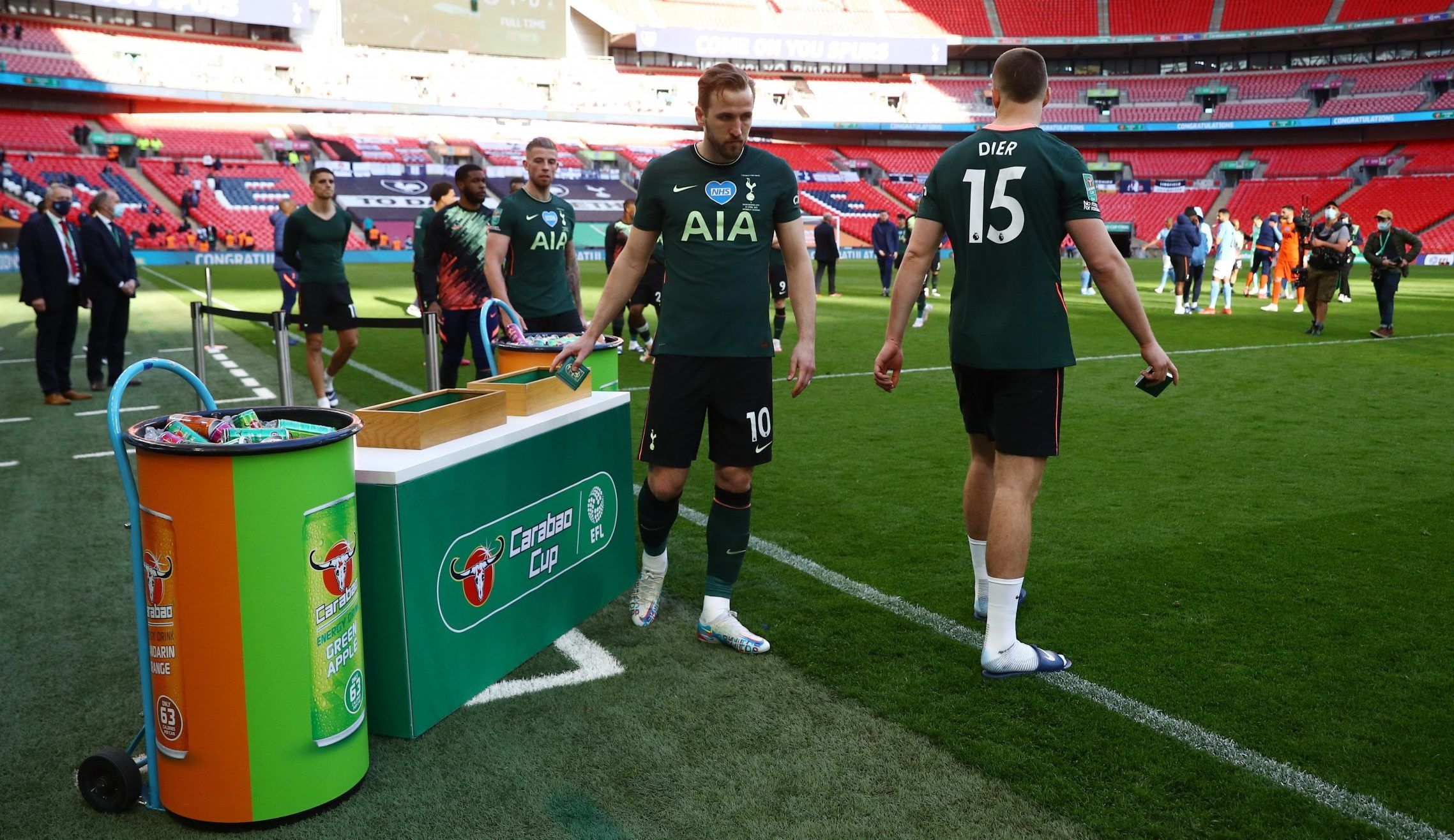 dejected harry kane and spurs players collect carabao cup runner up medals wembley