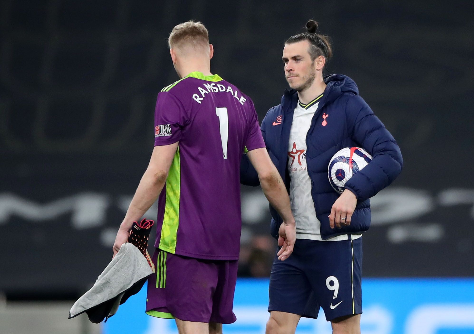Soccer Football - Premier League - Tottenham Hotspur v Sheffield United - Tottenham Hotspur Stadium, London, Britain - May 2, 2021 Tottenham Hotspur's Gareth Bale shakes hands with Sheffield United's Aaron Ramsdale after the match Pool via REUTERS/Nick Potts EDITORIAL USE ONLY. No use with unauthorized audio, video, data, fixture lists, club/league logos or 'live' services. Online in-match use limited to 75 images, no video emulation. No use in betting, games or single club /league/player public
