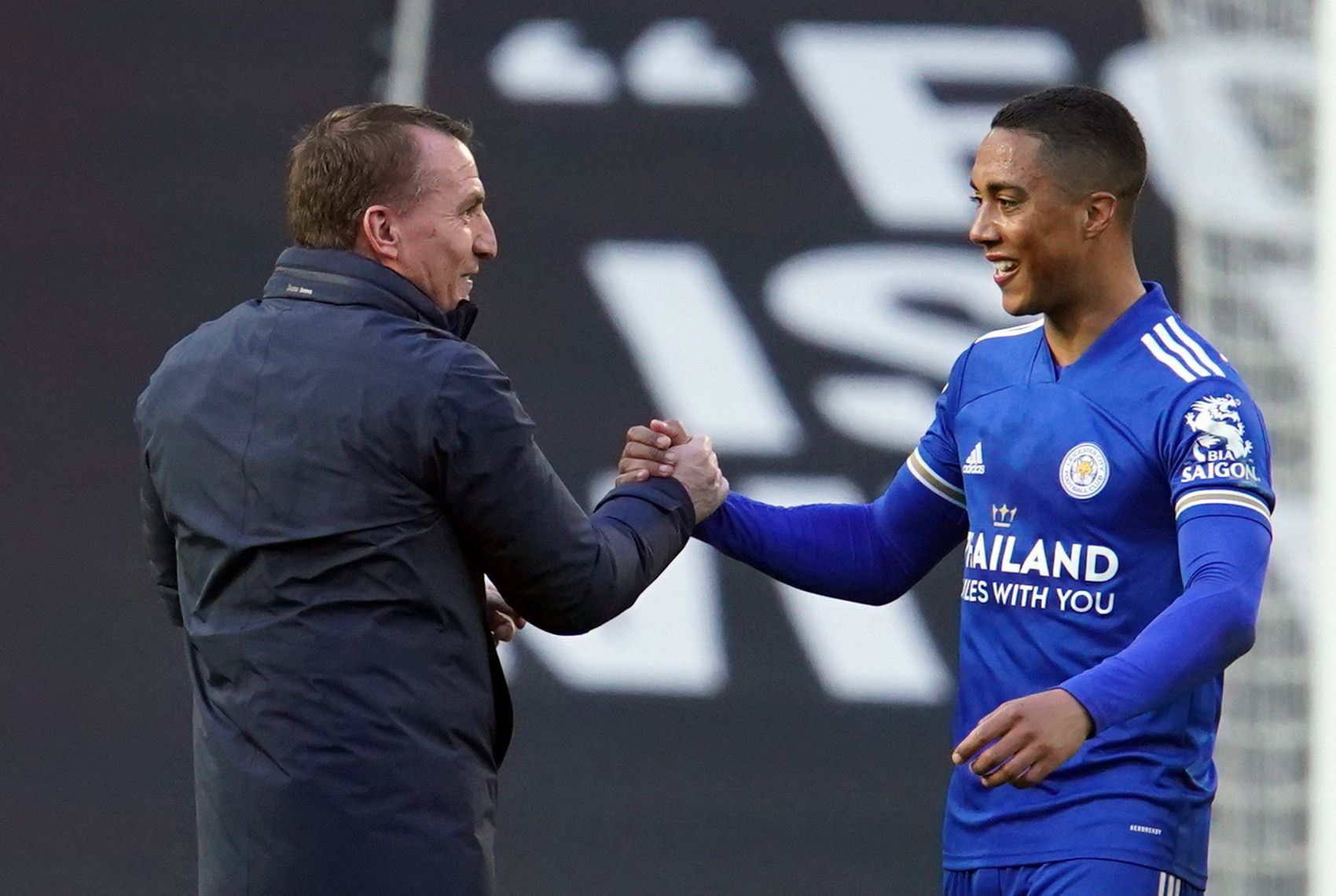 Soccer Football - Premier League - Manchester United v Leicester City - Old Trafford, Manchester, Britain - May 11, 2021 Leicester City's Youri Tielemans celebrate with manager Brendan Rodgers after the match Pool via REUTERS/Dave Thompson EDITORIAL USE ONLY. No use with unauthorized audio, video, data, fixture lists, club/league logos or 'live' services. Online in-match use limited to 75 images, no video emulation. No use in betting, games or single club /league/player publications.  Please con