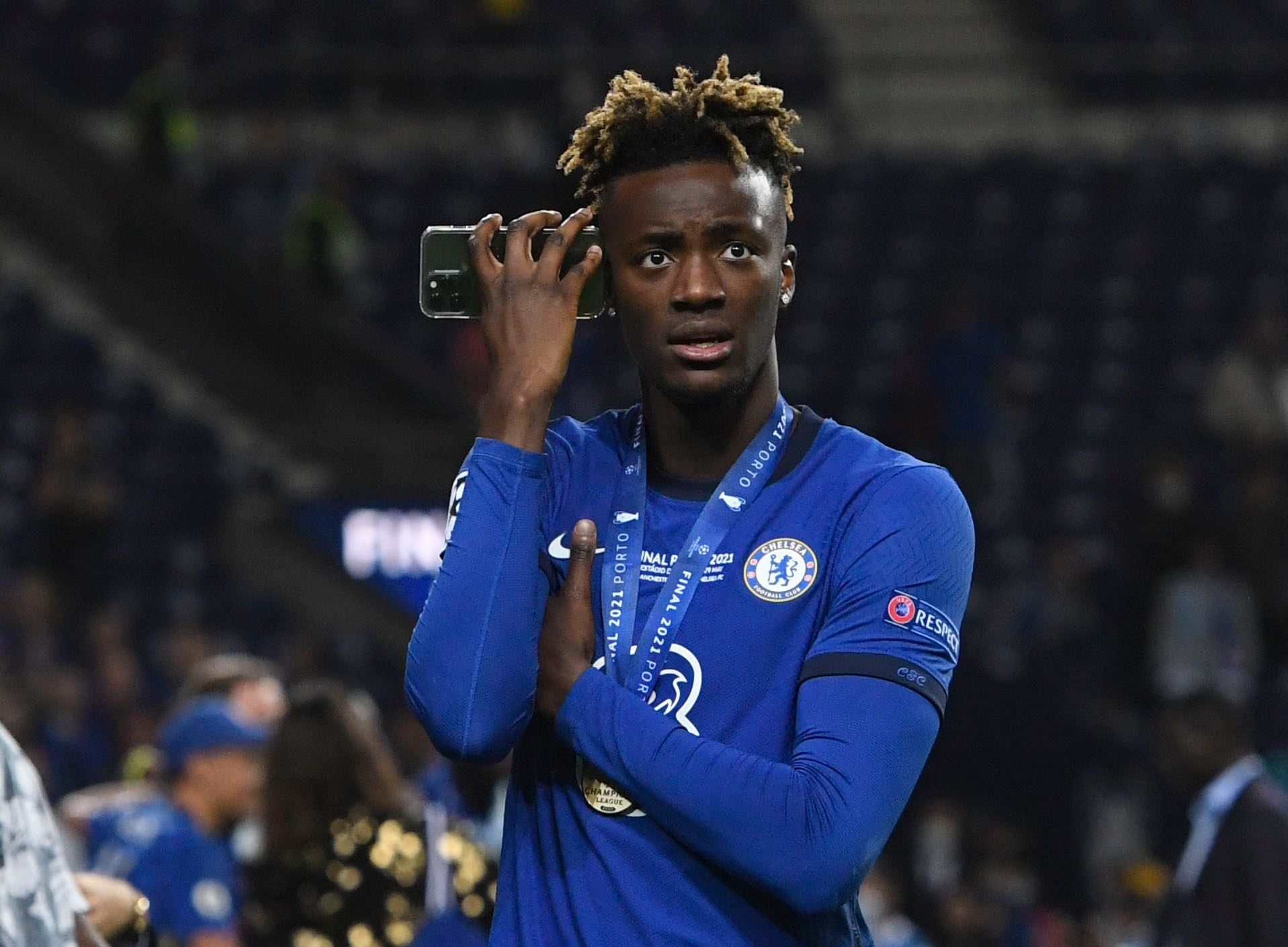 Soccer Football - Champions League Final - Manchester City v Chelsea - Estadio do Dragao, Porto, Portugal - May 29, 2021 Chelsea's Tammy Abraham talks on the phone after winning the Champions League Pool via REUTERS/Pierre-Philippe Marcou