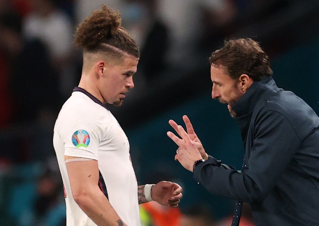 Soccer Football - Euro 2020 - Final - Italy v England - Wembley Stadium, London, Britain - July 11, 2021 England manager Gareth Southgate speaks with Kalvin Phillips Pool via REUTERS/Carl Recine