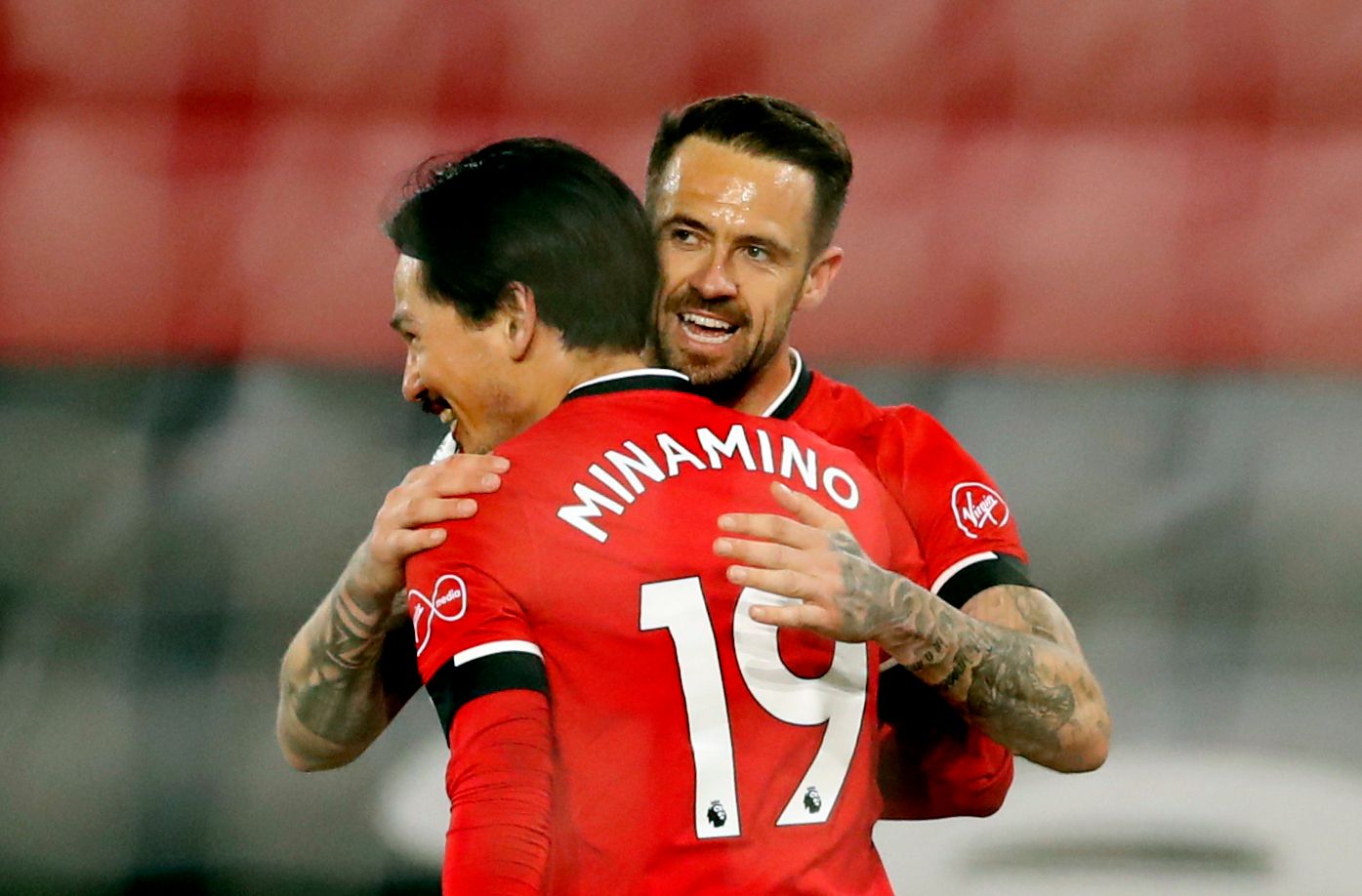 Soccer Football - Premier League - Southampton v Crystal Palace - St Mary's Stadium, Southampton, Britain - May 11, 2021 Southampton's Danny Ings celebrates scoring their third goal with Takumi Minamino Pool via REUTERS/Andrew Boyers EDITORIAL USE ONLY. No use with unauthorized audio, video, data, fixture lists, club/league logos or 'live' services. Online in-match use limited to 75 images, no video emulation. No use in betting, games or single club /league/player publications.  Please contact y