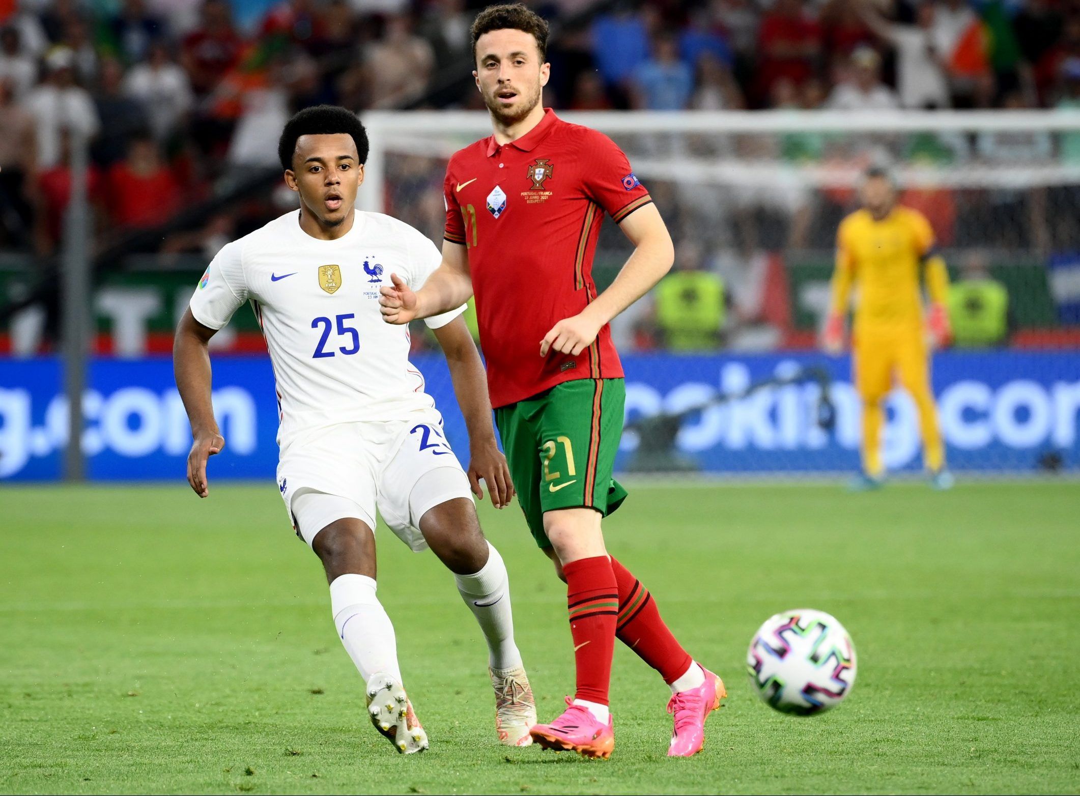 france defender jules kounde in action against portugal winger diogo jota at euro 2020