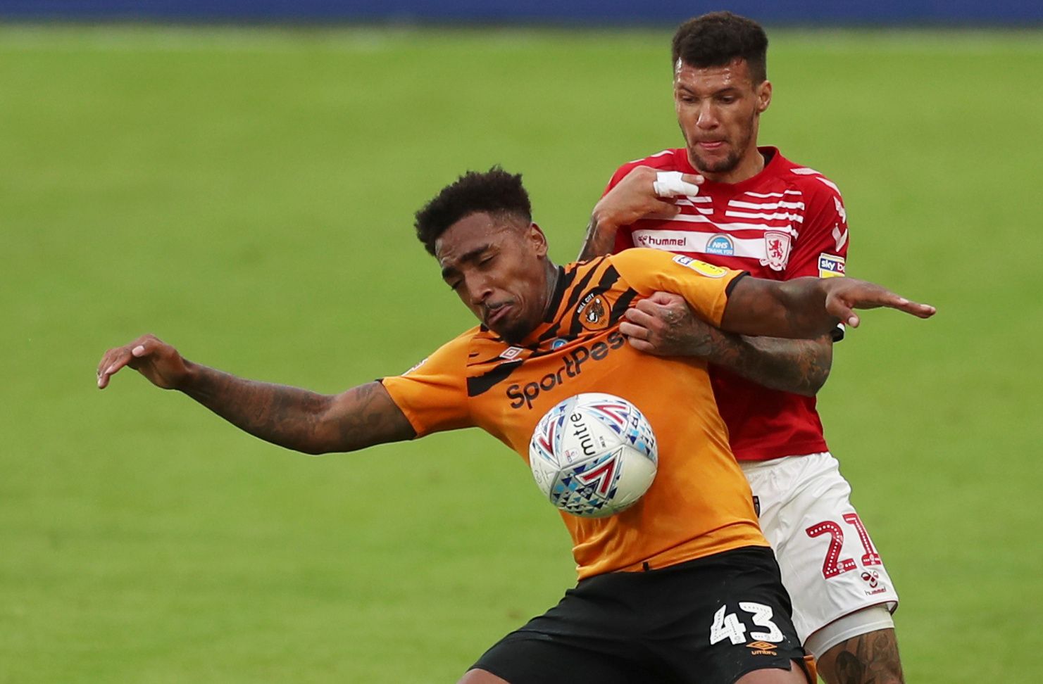 Soccer Football - Championship - Hull City v Middlesbrough - KCOM Stadium, Hull, Britain - July 2, 2020  Middlesbrough's Marvin Johnson in action with Hull City's Mallik Wilks, as play resumes behind closed doors following the outbreak of the coronavirus disease (COVID-19)   Action Images/Lee Smith    EDITORIAL USE ONLY. No use with unauthorized audio, video, data, fixture lists, club/league logos or 
