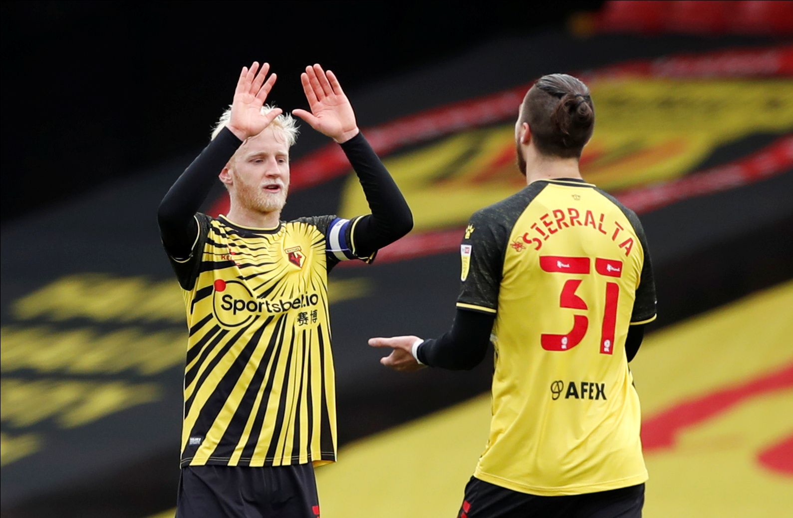 Soccer Football - Championship - Watford v Sheffield Wednesday - Vicarage Road, Watford, Britain - April 2, 2021  Watford's Will Hughes and Francisco Sierralta celebrate after the match   Action Images/Paul Childs  EDITORIAL USE ONLY. No use with unauthorized audio, video, data, fixture lists, club/league logos or 