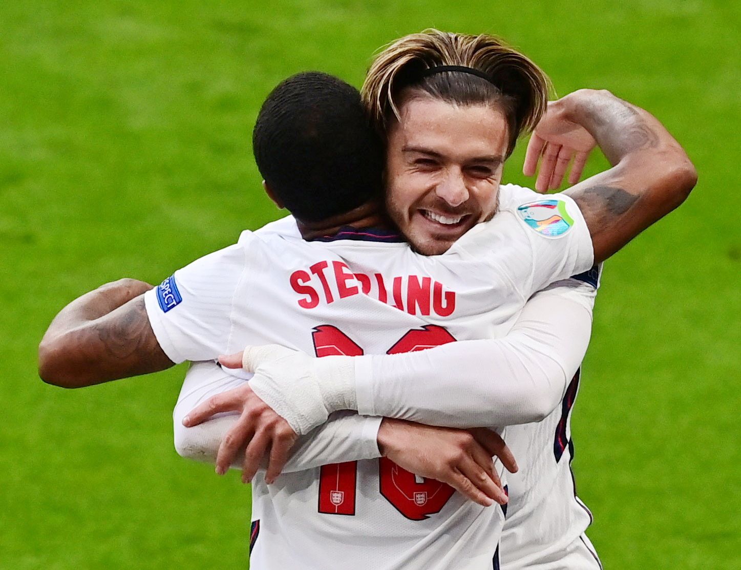 FILE PHOTO: Soccer Football - Euro 2020 - Group D - Czech Republic v England - Wembley Stadium, London, Britain - June 22, 2021 England's Raheem Sterling celebrates scoring their first goal with Jack Grealish Pool via REUTERS/Neil Hall/File Photo