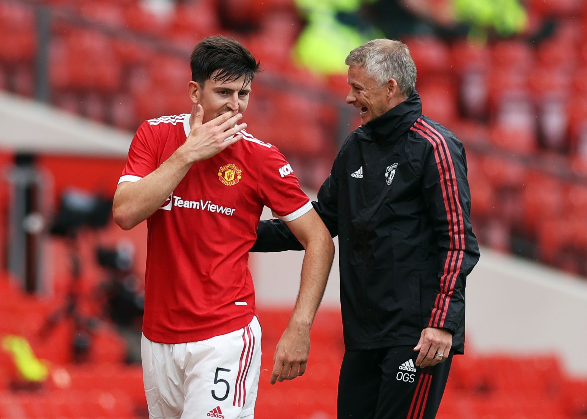 Soccer Football - Pre Season Friendly - Manchester United v Everton - Old Trafford, Manchester, Britain - August 7, 2021 Manchester United's Harry Maguire speaks with manager Ole Gunnar Solskjaer as he walks off to be substituted Action Images via Reuters/Lee Smith