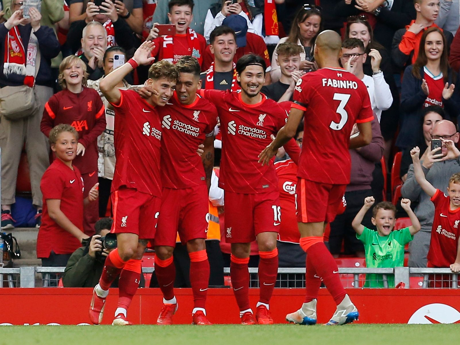 Soccer Football - Pre Season Friendly - Liverpool v Osasuna - Anfield, Liverpool, Britain - August 9, 2021 Liverpool's Roberto Firmino celebrates scoring their second goal with teammates Action Images via Reuters/Craig Brough