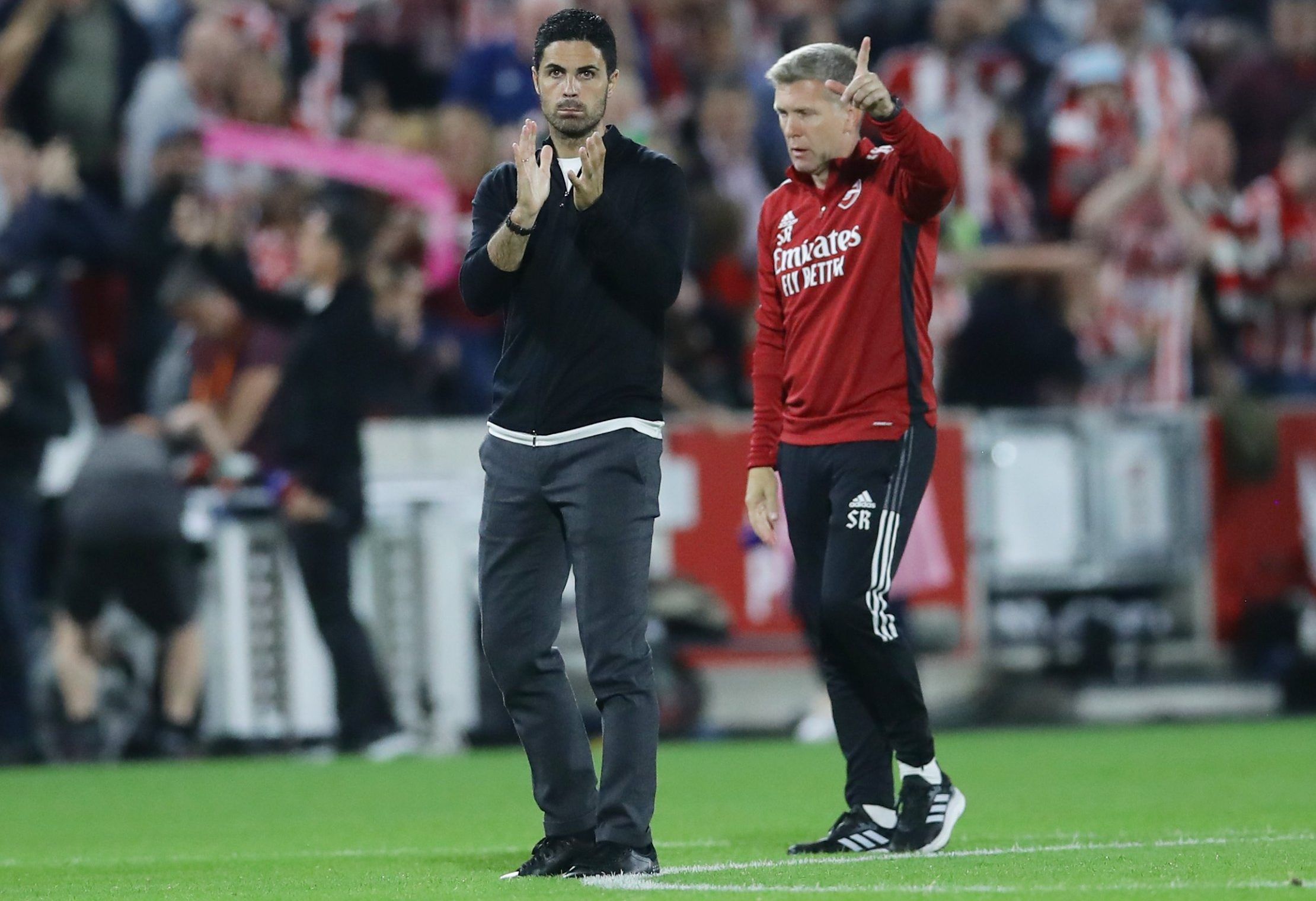 Arsenal manager Mikel Arteta and assistant look on after Brentford defeat