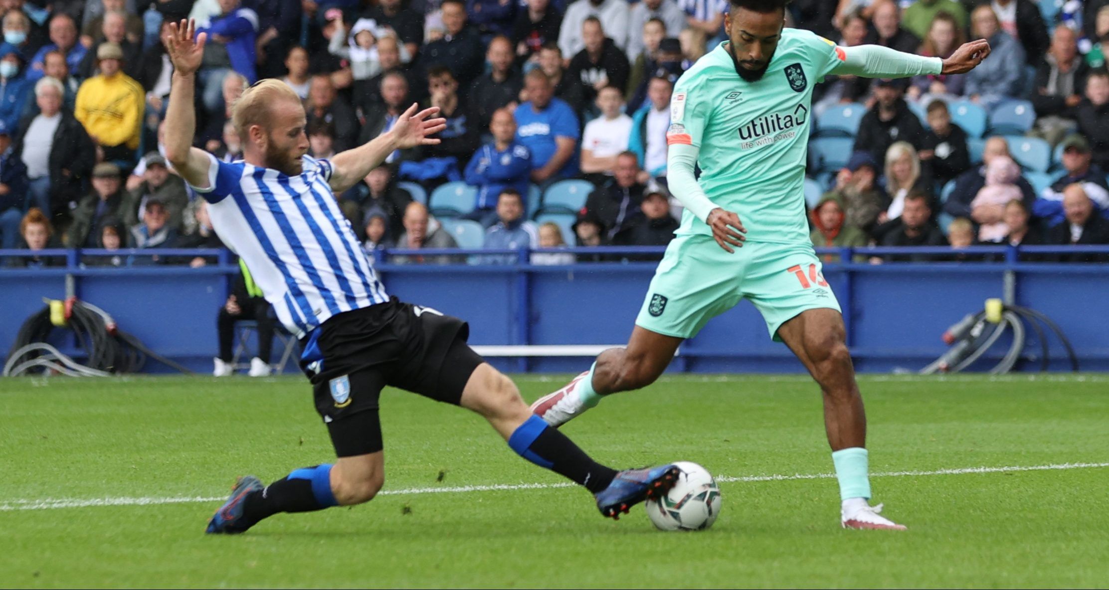 Soccer Football - Carabao Cup First Round - Sheffield Wednesday v Huddersfield Town - Hillsborough, Sheffield, Britain - August 1, 2021 Sheffield Wednesday's Barry Bannan in action with Huddersfield Town's Sorba Thomas Action Images/Lee Smith