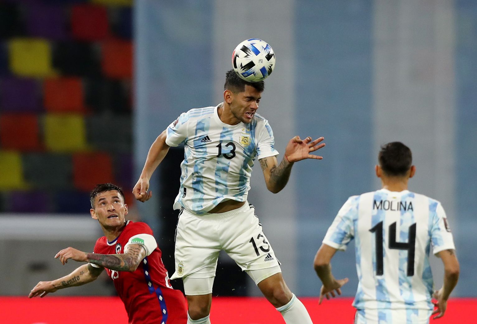 Soccer Football - World Cup - South American Qualifiers - Argentina v Chile - Estadio Unico, Santiago del Estero, Argentina - June 3, 2021 Argentina's Cristian Romero in action with Chile's Charles Aranguiz POOL via REUTERS/Agustin Marcarian