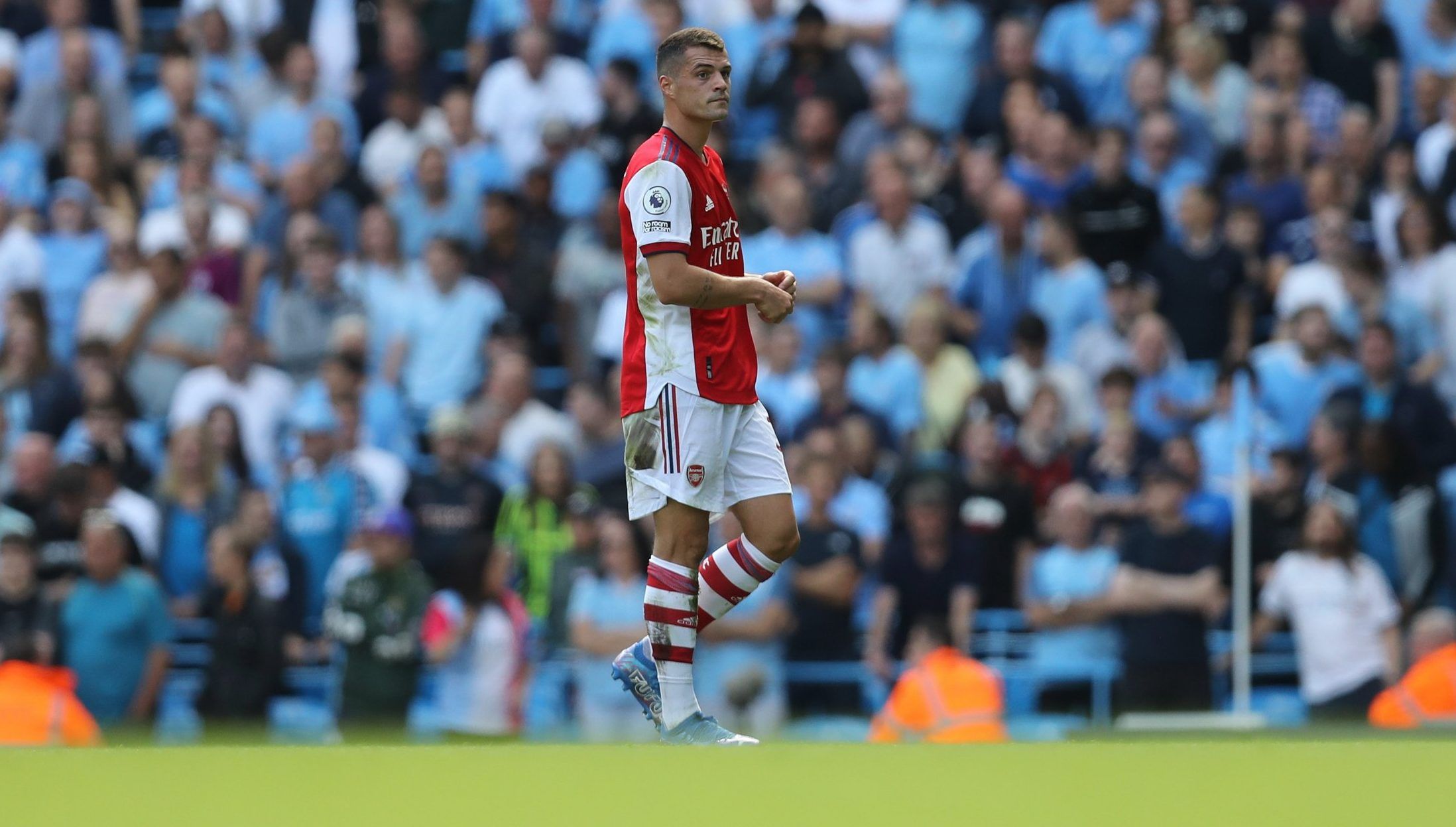 Arsenal midfielder Granit Xhaka walks off the pitch after being sent off against Manchester City in the Premier League