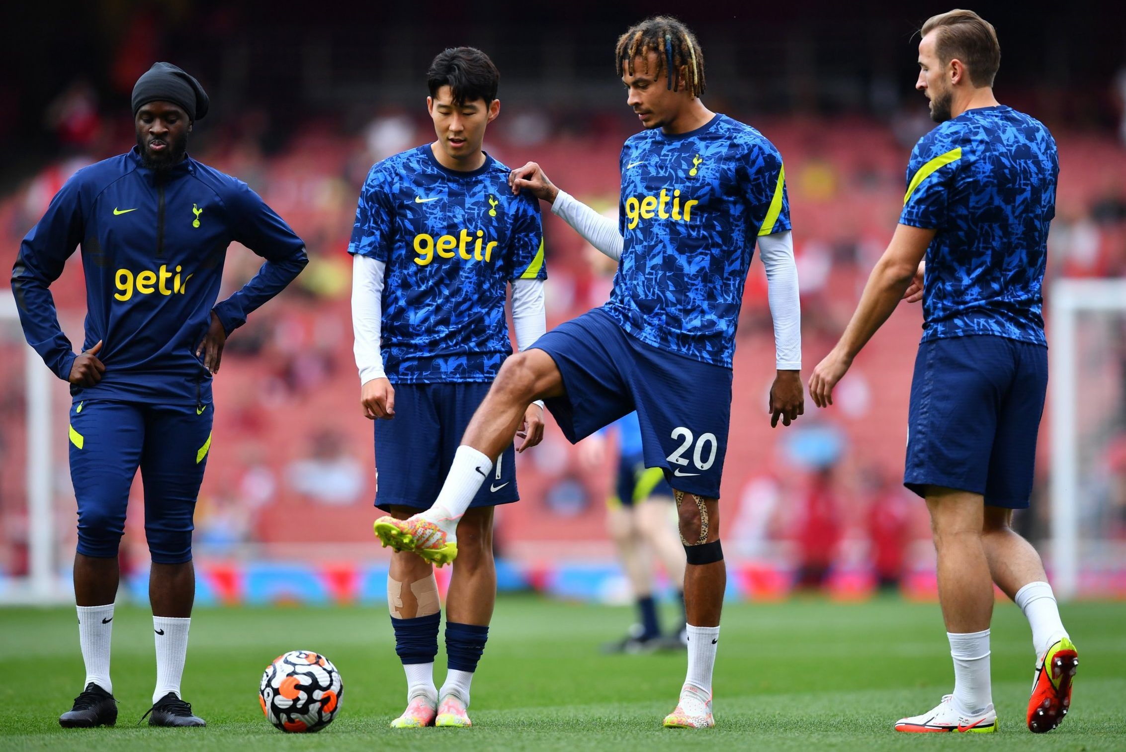 Dele Alli and Spurs players during warm up for the north London derby
