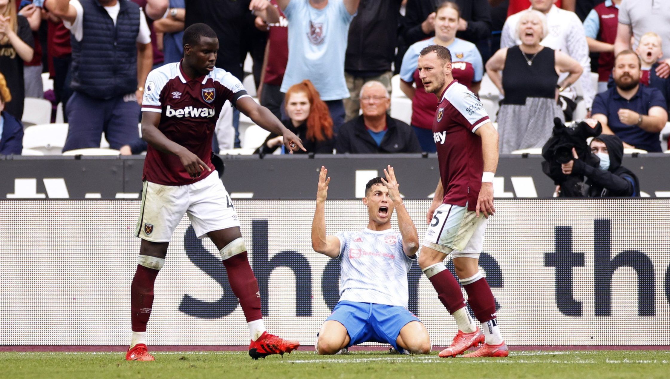West Ham's Kurt Zouma reacts after Cristiano Ronaldo goes down inside the penalty area