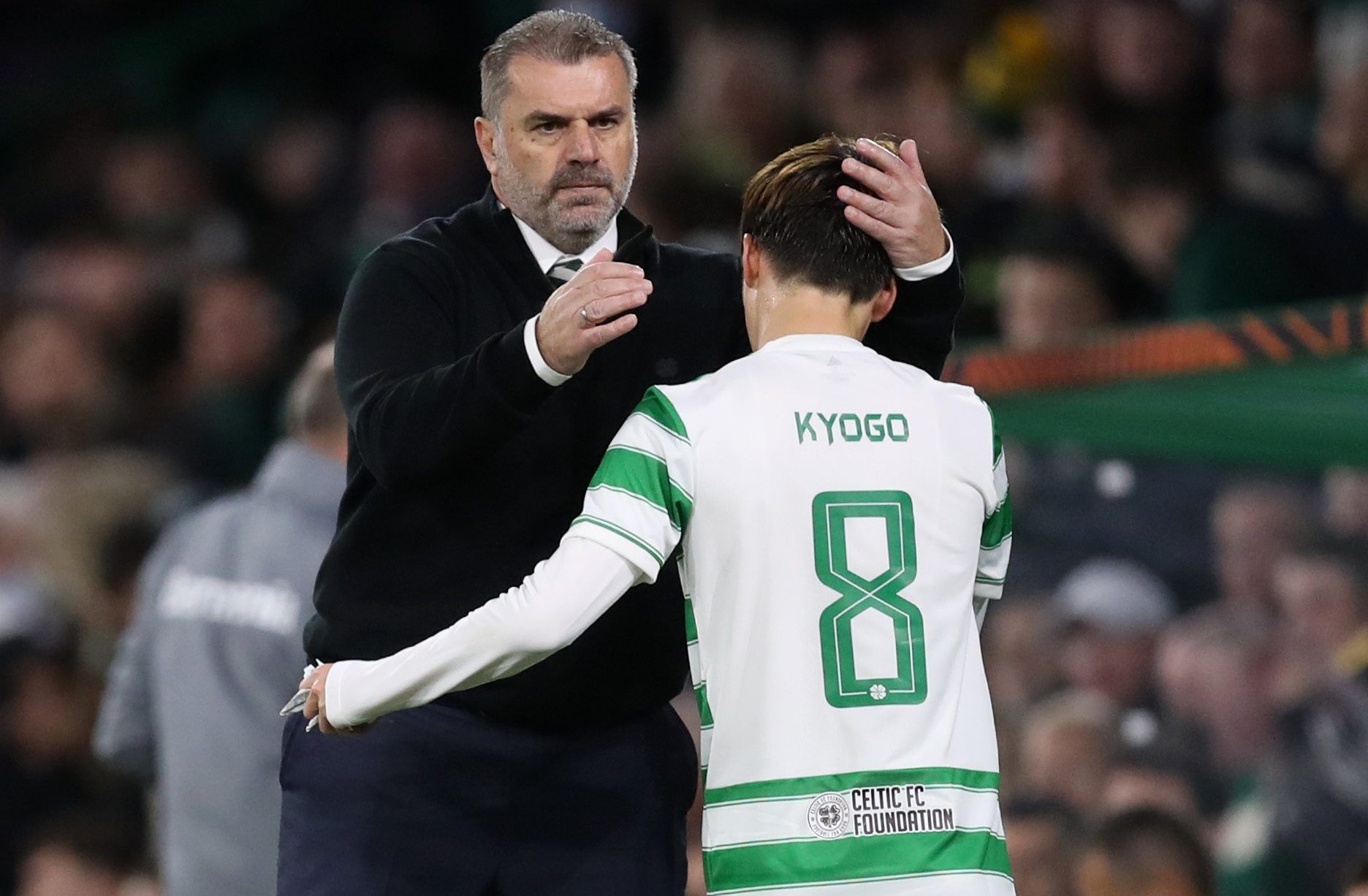 Soccer Football - Europa League - Group G - Celtic v Bayer Leverkusen - Celtic Park, Glasgow, Scotland, Britain - September 30, 2021 Celtic's Kyogo Furuhashi with manager Angelos Postecoglou after he comes off as a substitute REUTERS/Russell Cheyne