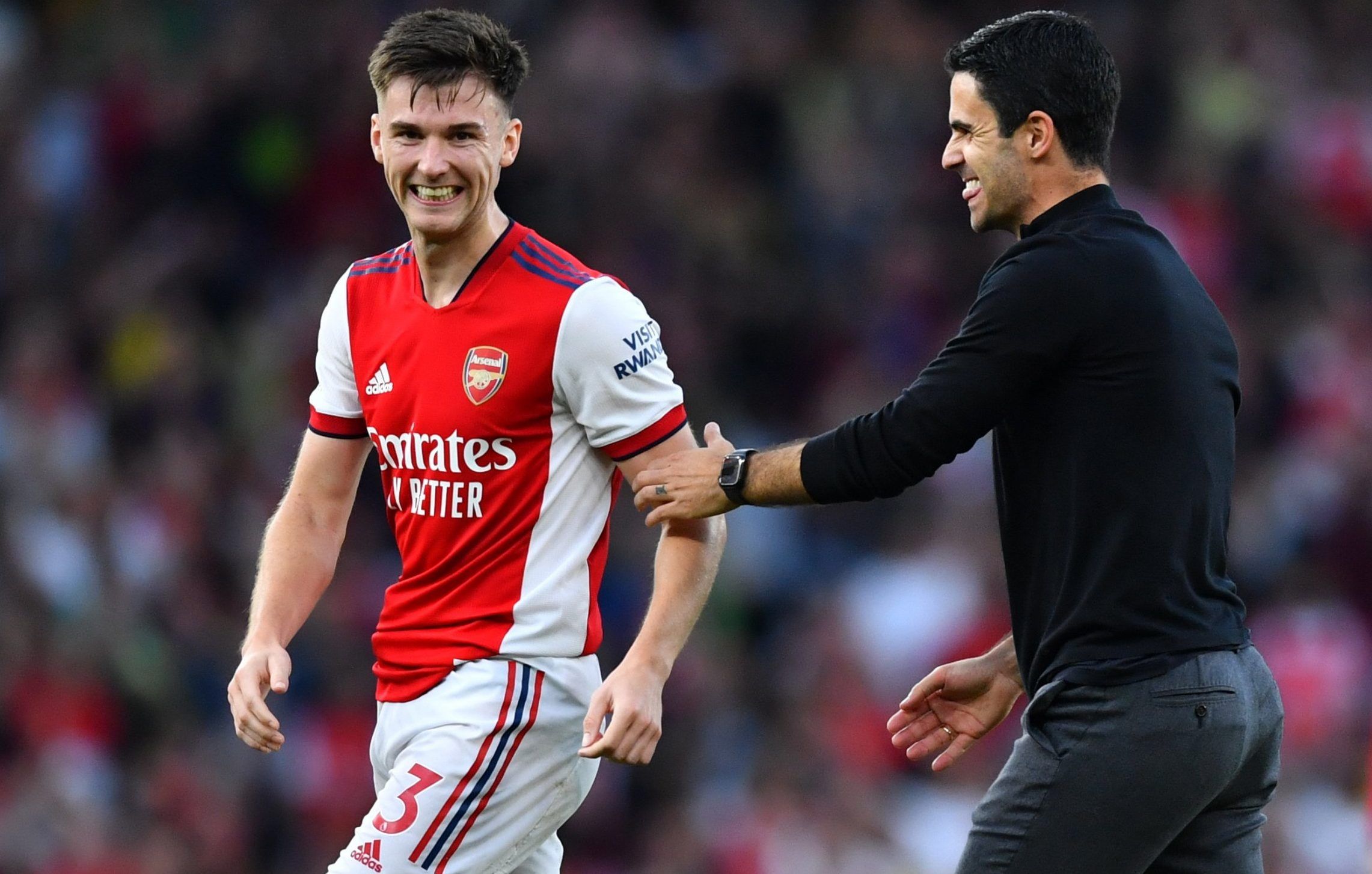 Arsenal defender Kieran Tierney celebrates north London derby win over Spurs with manager Mikel Arteta