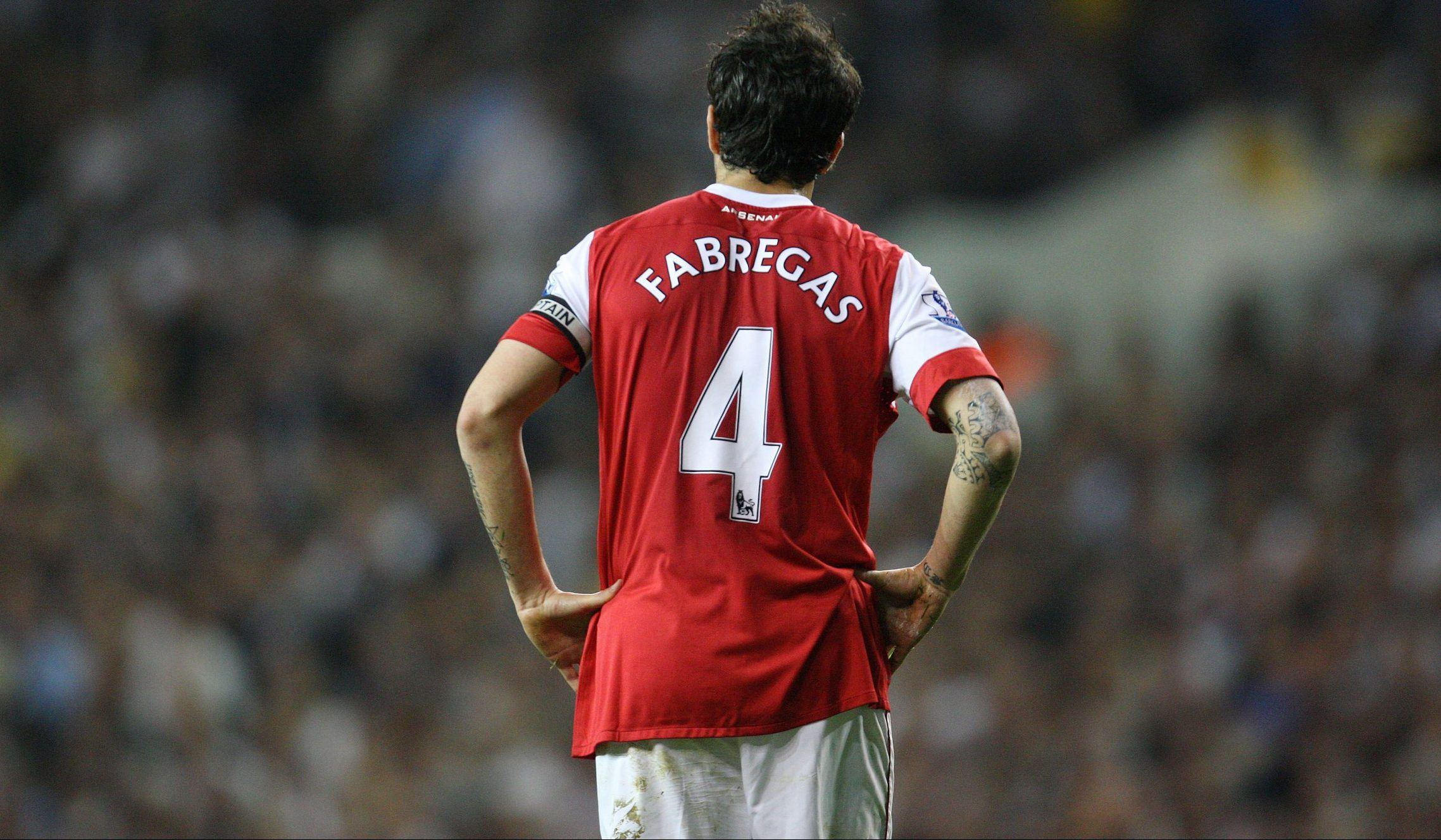 Former Arsenal midfielder Cesc Fabregas looks on against Spurs