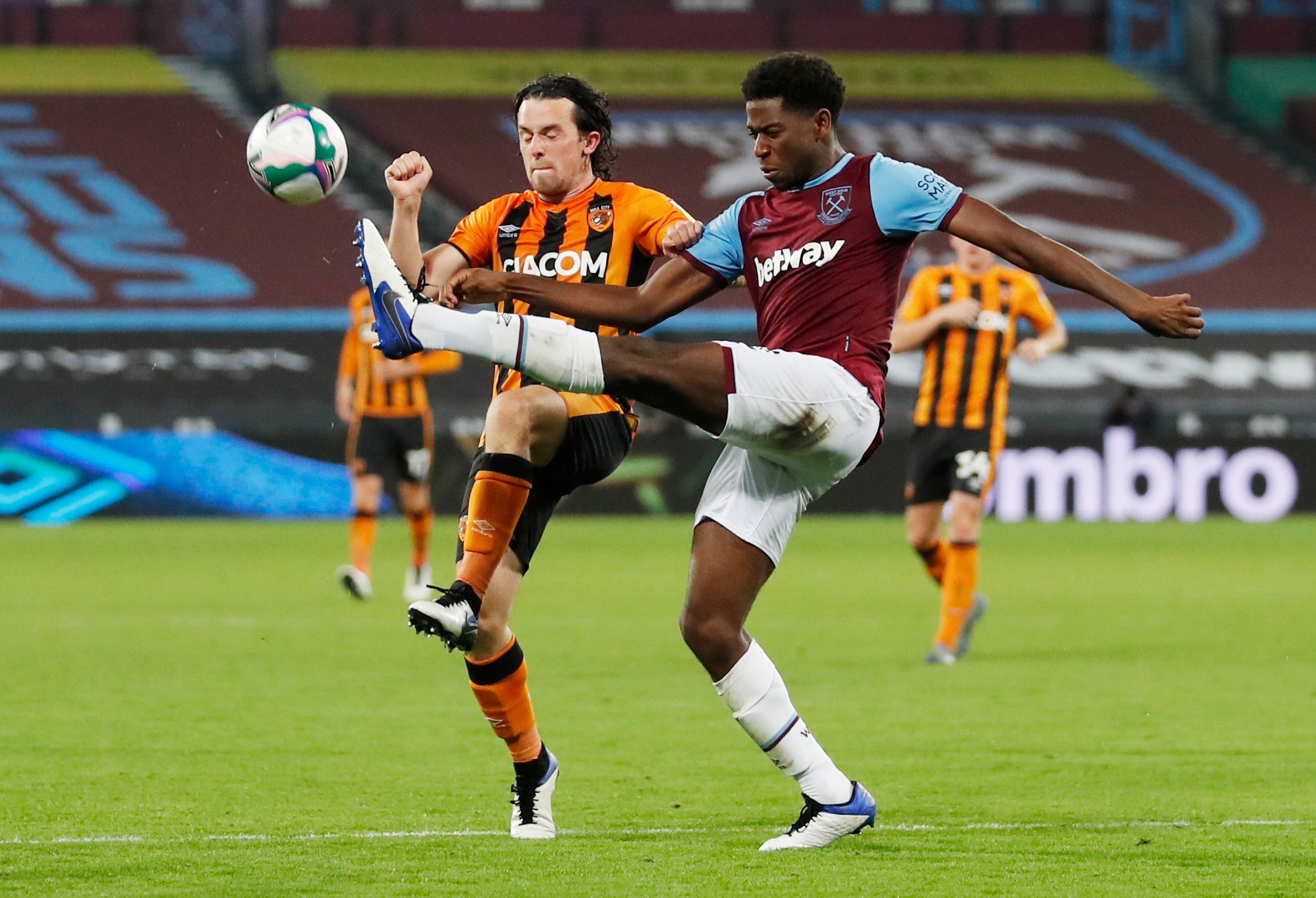 Soccer Football - Carabao Cup Third Round - West Ham United v Hull City - London Stadium, London, Britain - September 22, 2020.  West Ham United's Aji Alese in action with  Hull City's George Honeyman. Pool via REUTERS/Alastair Grant EDITORIAL USE ONLY. No use with unauthorized audio, video, data, fixture lists, club/league logos or 'live' services. Online in-match use limited to 75 images, no video emulation. No use in betting, games or single club/league/player publications.  Please contact yo