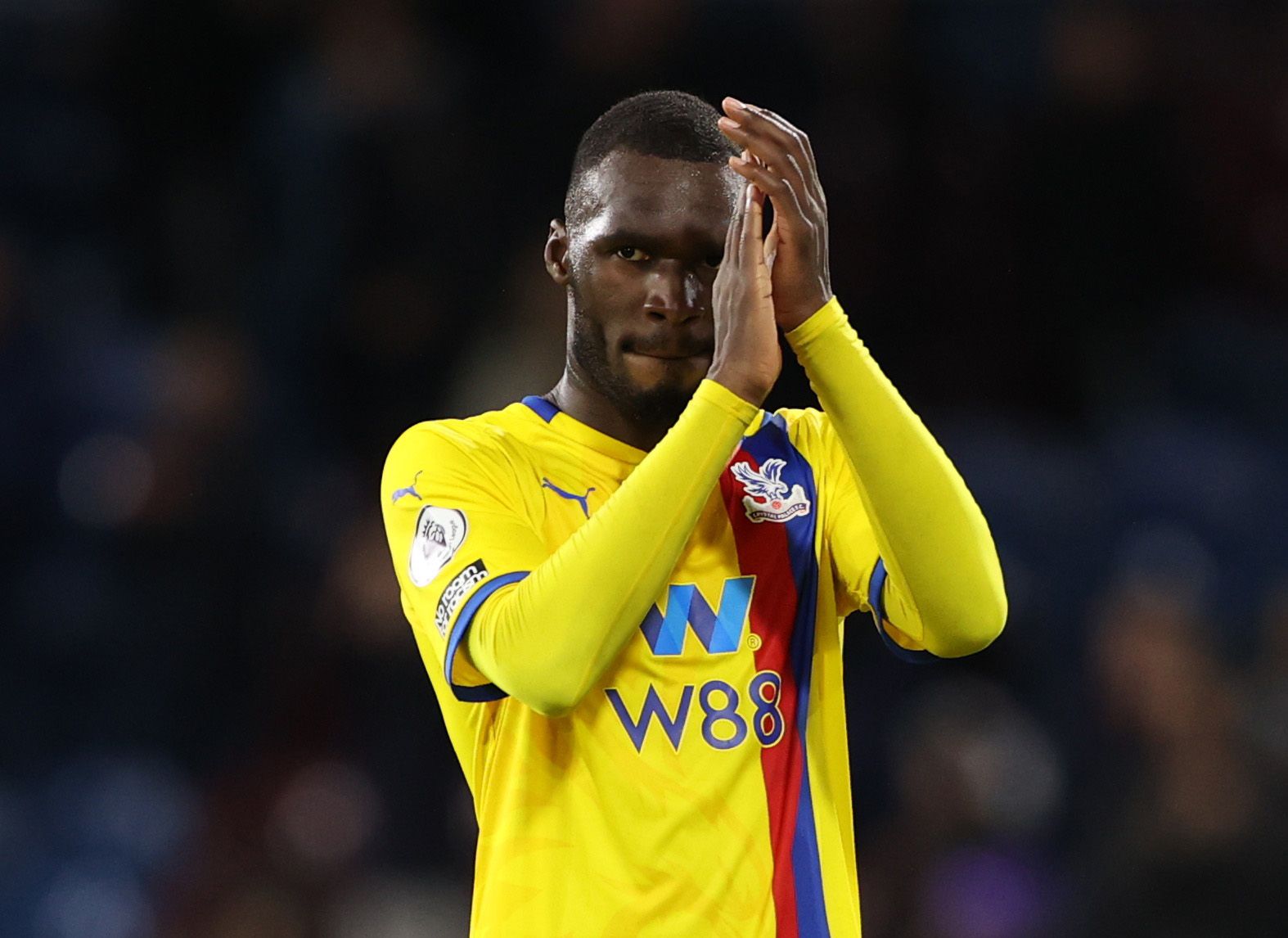 Soccer Football - Premier League - Burnley v Crystal Palace - Turf Moor, Burnley, Britain - November 20, 2021  Crystal Palace's Christian Benteke applauds the fans after the match Action Images via Reuters/Molly Darlington EDITORIAL USE ONLY. No use with unauthorized audio, video, data, fixture lists, club/league logos or 'live' services. Online in-match use limited to 75 images, no video emulation. No use in betting, games or single club /league/player publications.  Please contact your account
